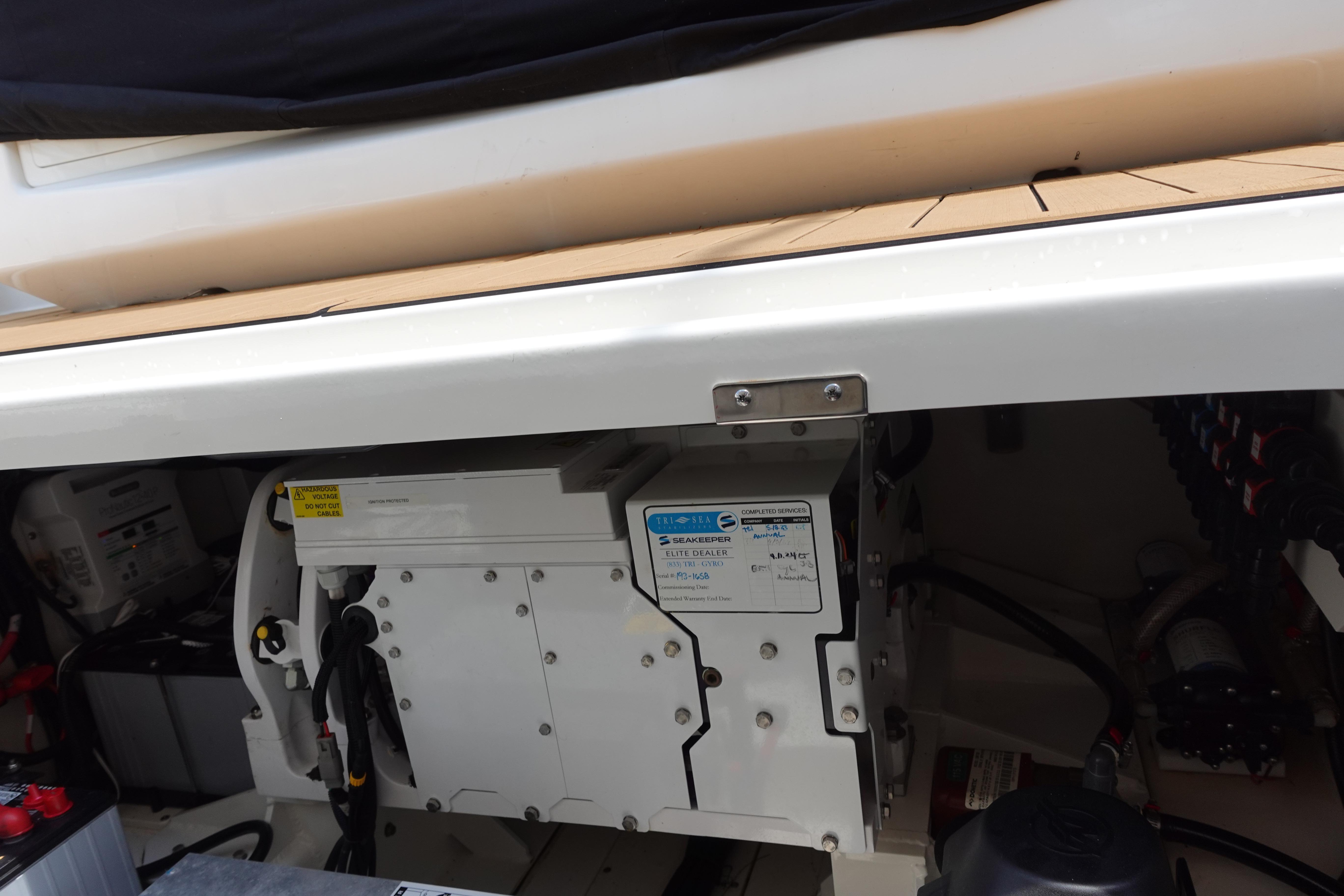 Engine compartment of a 2020 Boston Whaler 420 Outrage, showcasing mechanical components.
