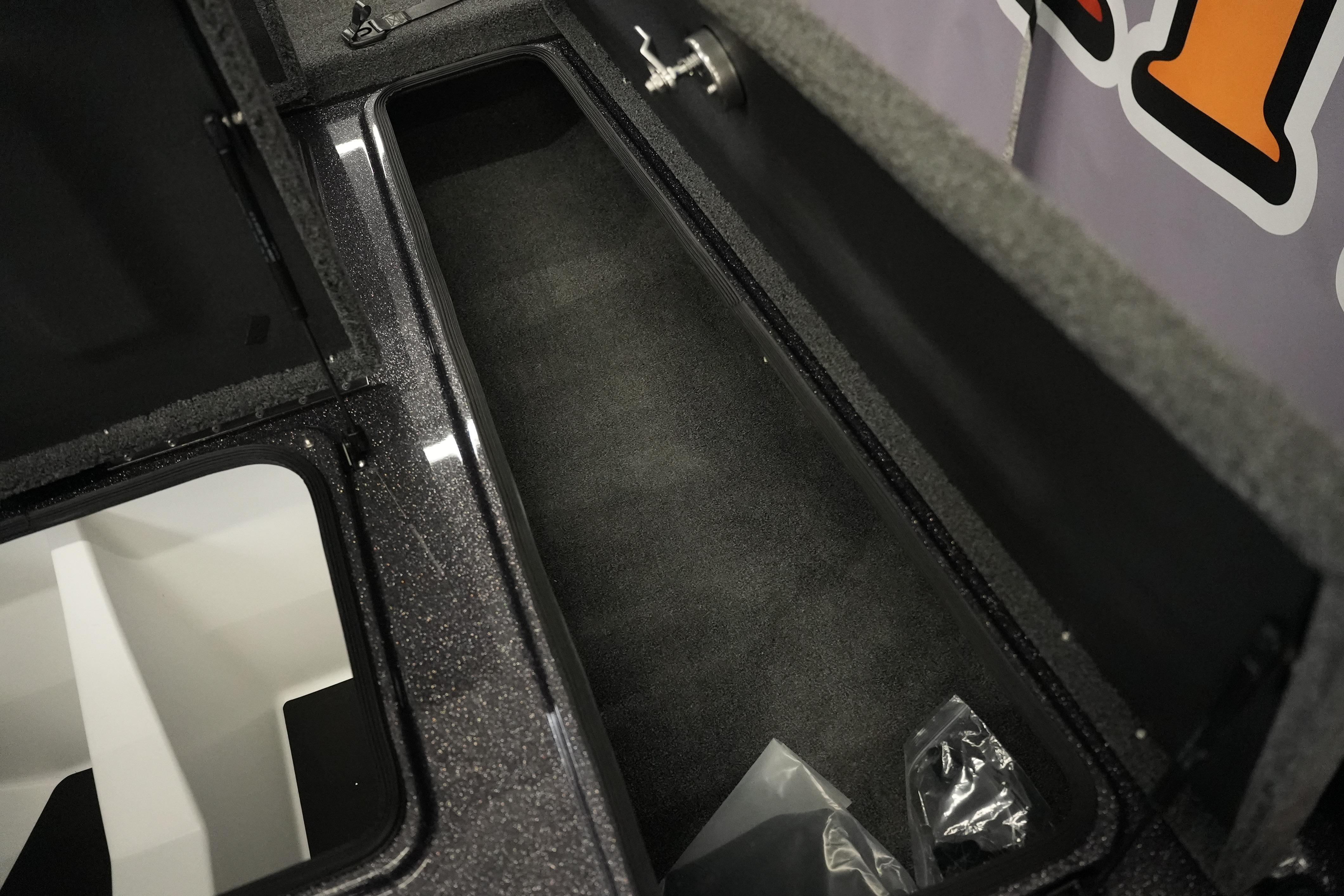 Storage compartment of 2026 Bass Cat Puma STS boat, featuring spacious interior design.