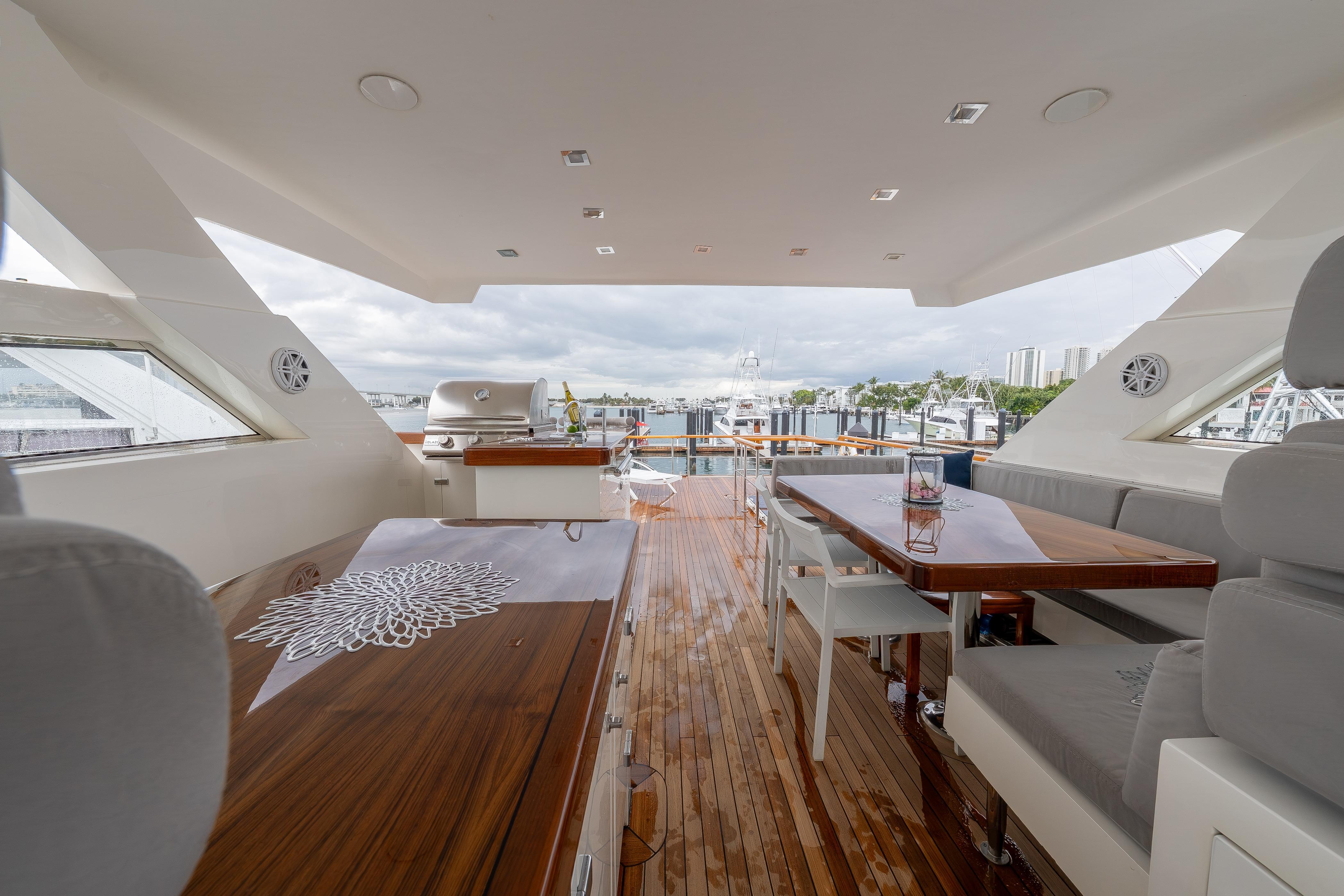 Luxurious 2012 Lazzara Breeze yacht interior with elegant seating and dining area.