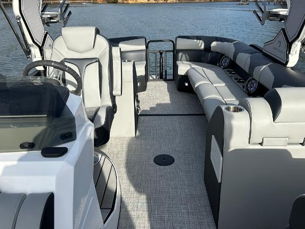 2025 Montara Surf Boss 2.0 25 boat interior with modern seating and steering wheel.
