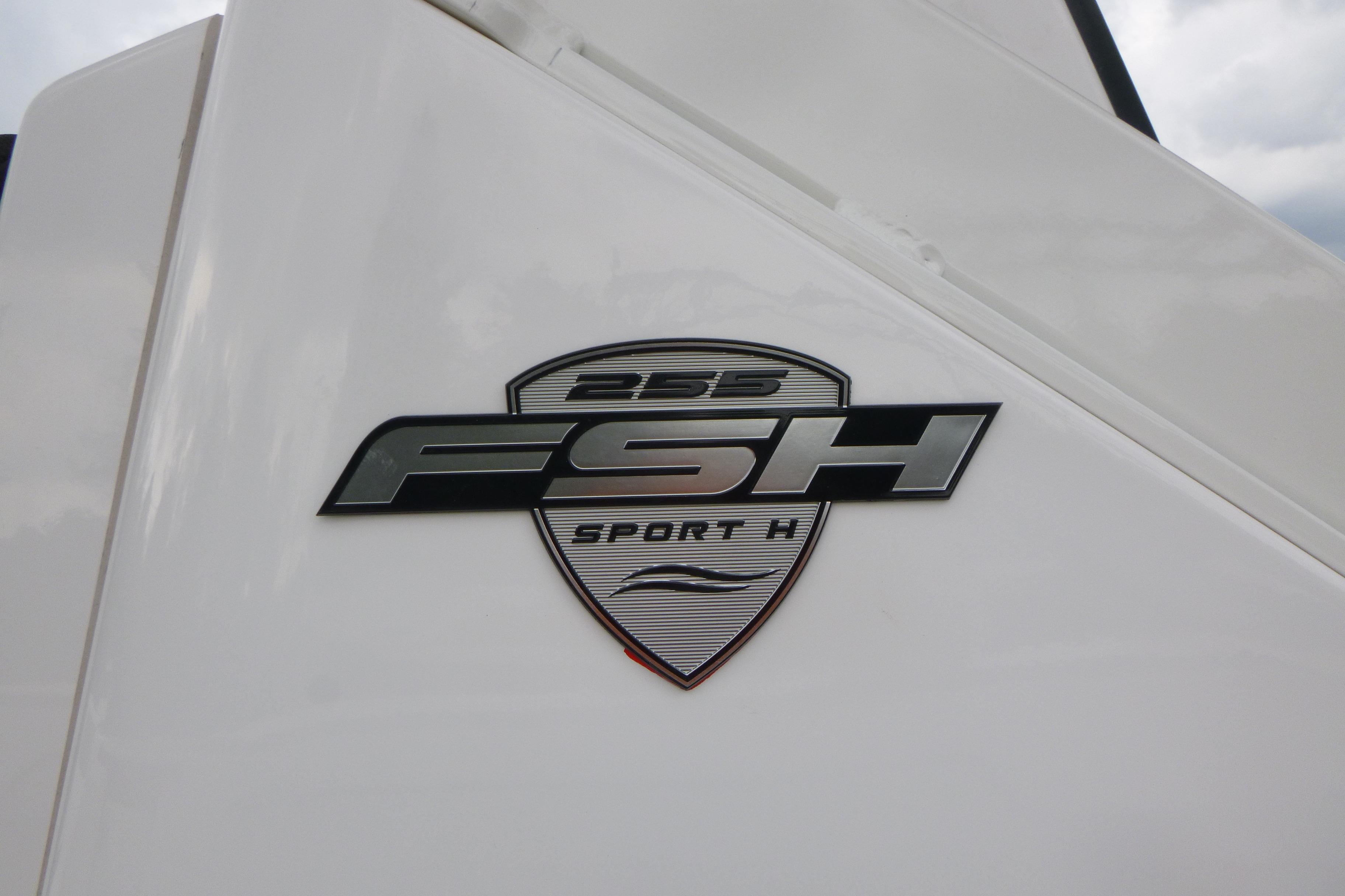 2026 Yamaha Boats 255 FSH Sport H logo on white surface.