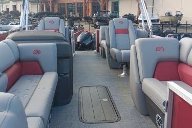 2026 Sun Tracker Party Barge 22 XP3 interior with gray and red seating.
