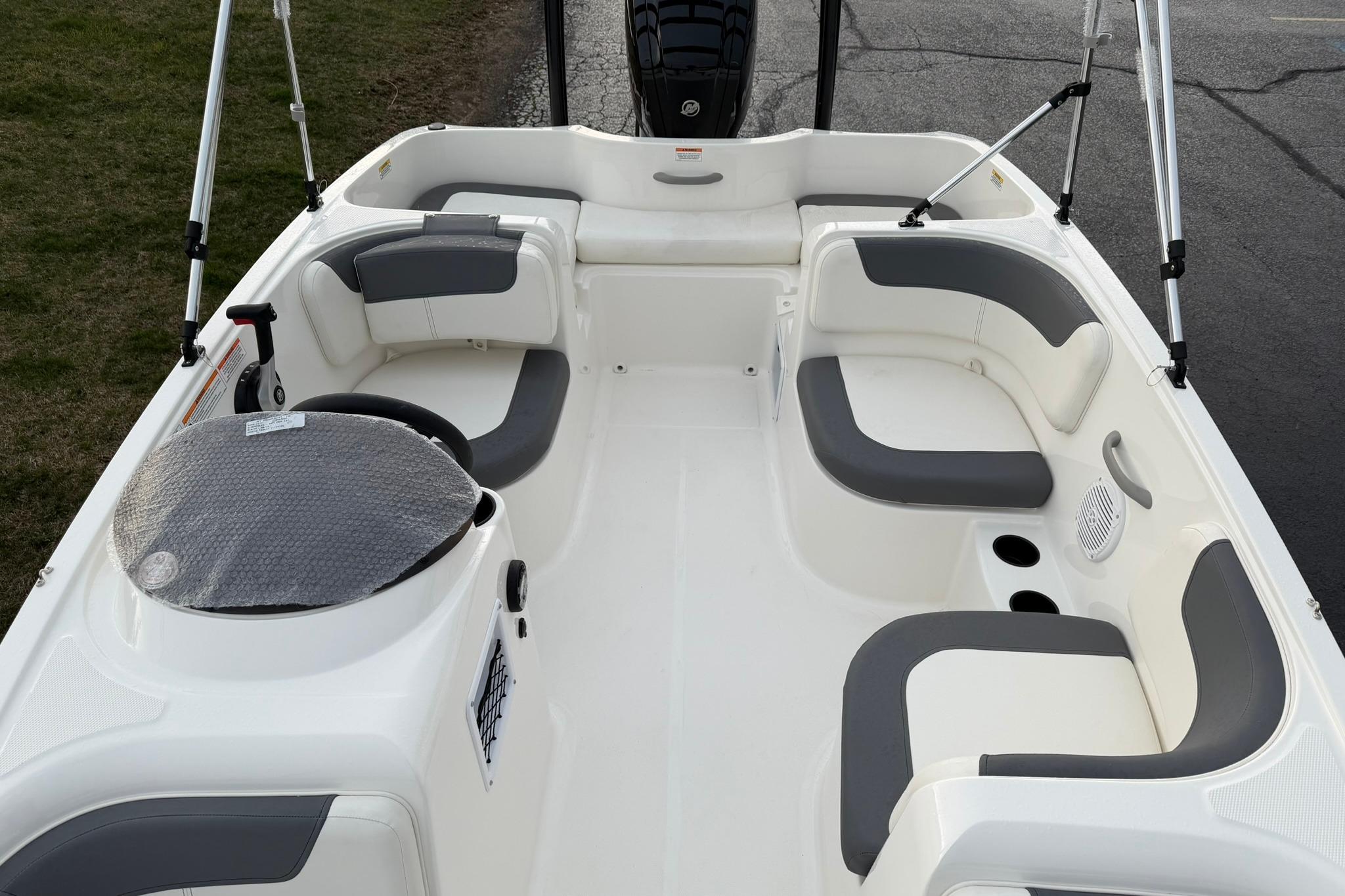 2026 Bayliner Element E16 boat interior with gray seating and steering wheel.