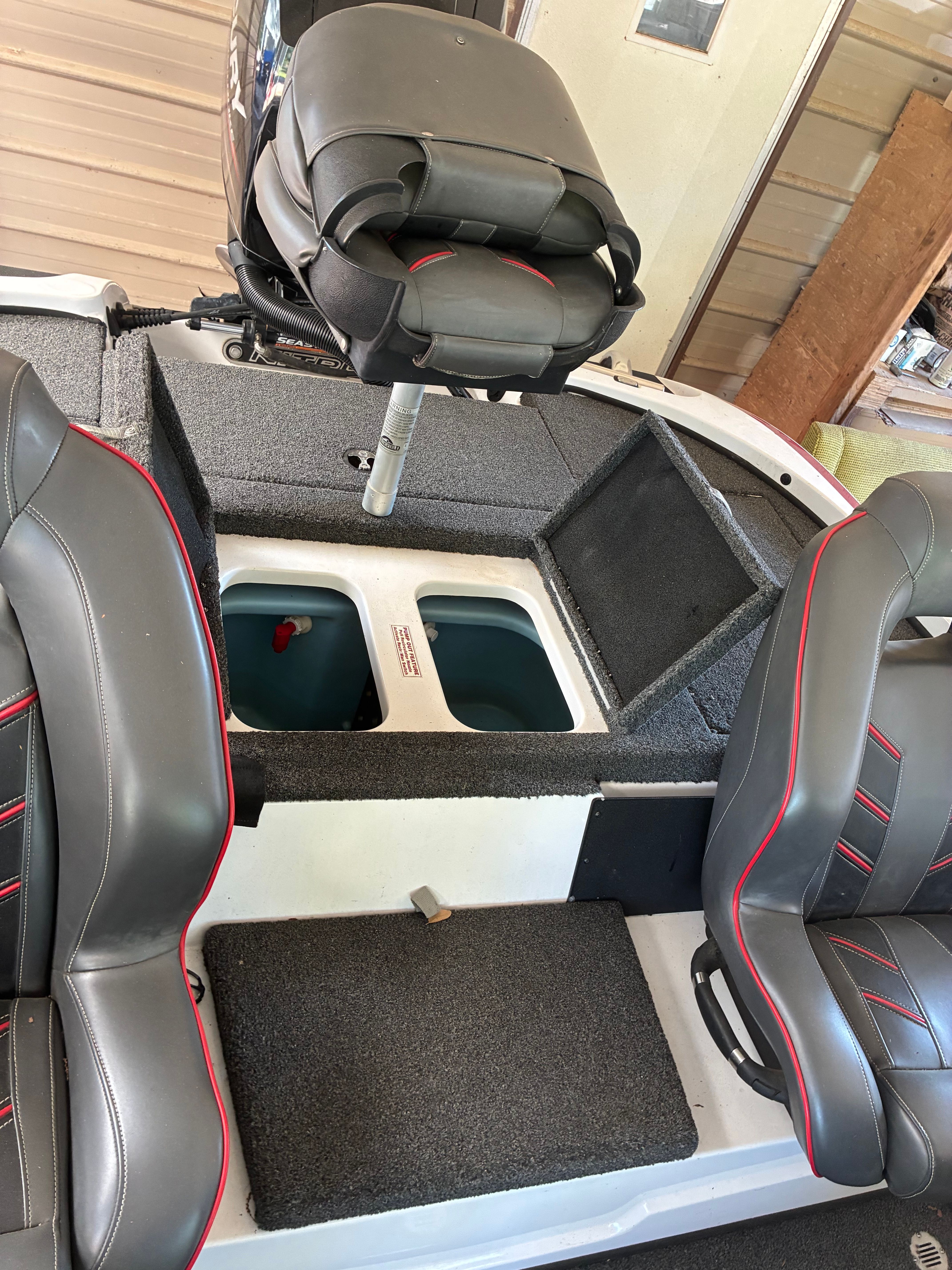 Interior view of a Nitro Z18 boat with gray seats and storage compartments.