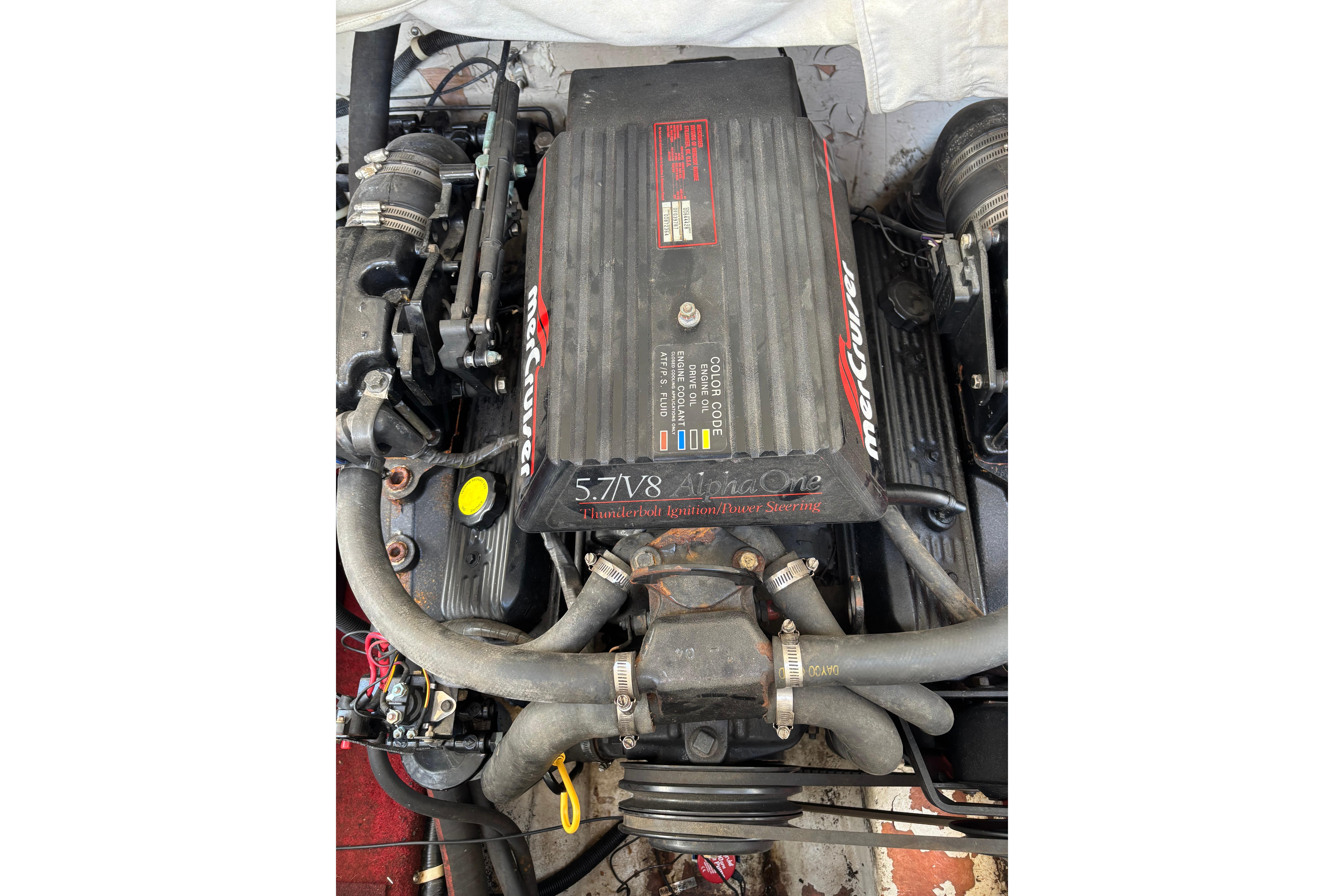 Engine of a 1993 Larson SEi 200 Cuddy I/O boat, featuring MerCruiser 5.7 V8.
