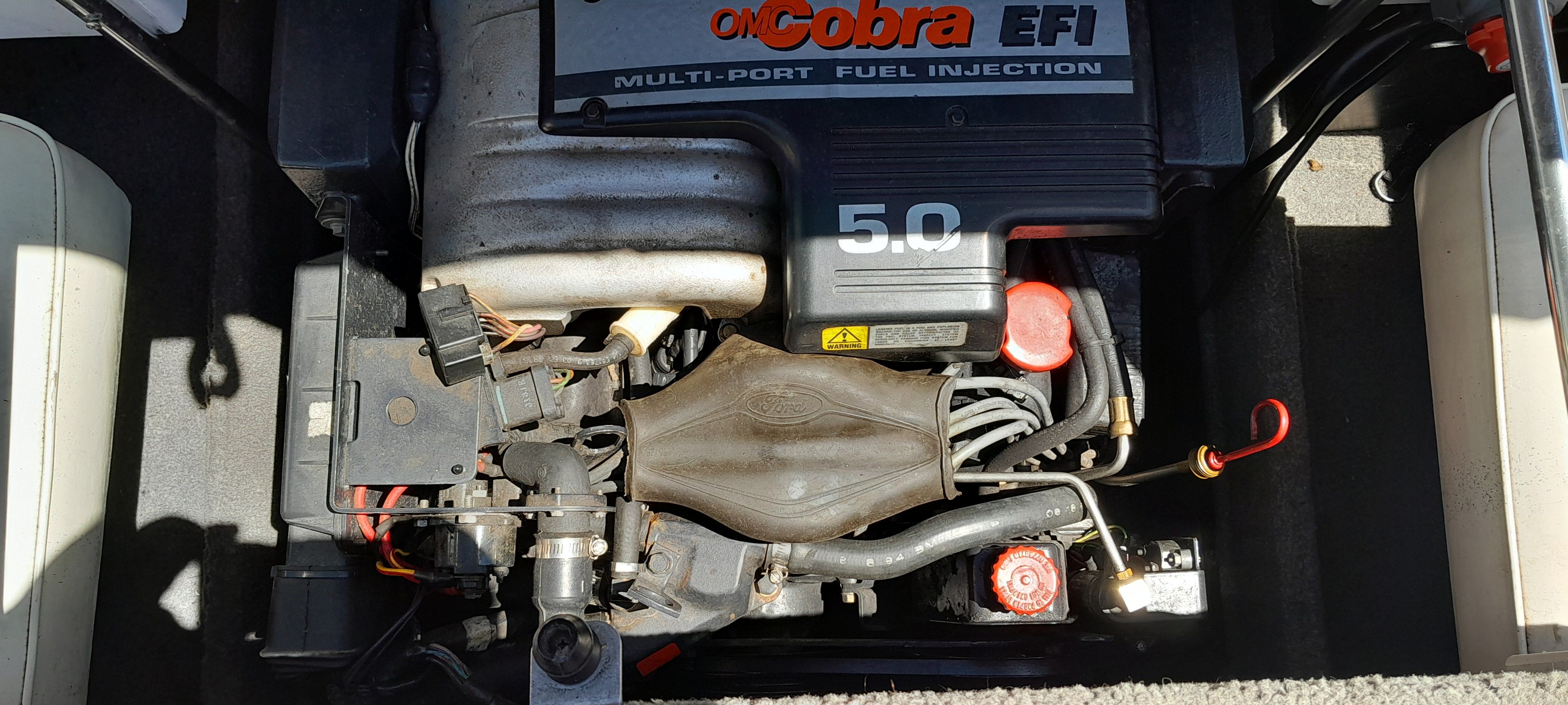 Engine of a 1995 Four Winns 205 Sundowner boat with OMC Cobra EFI.
