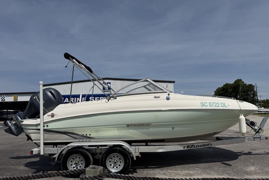 2019 Stingray 201 DS boat on trailer at marine service center.
