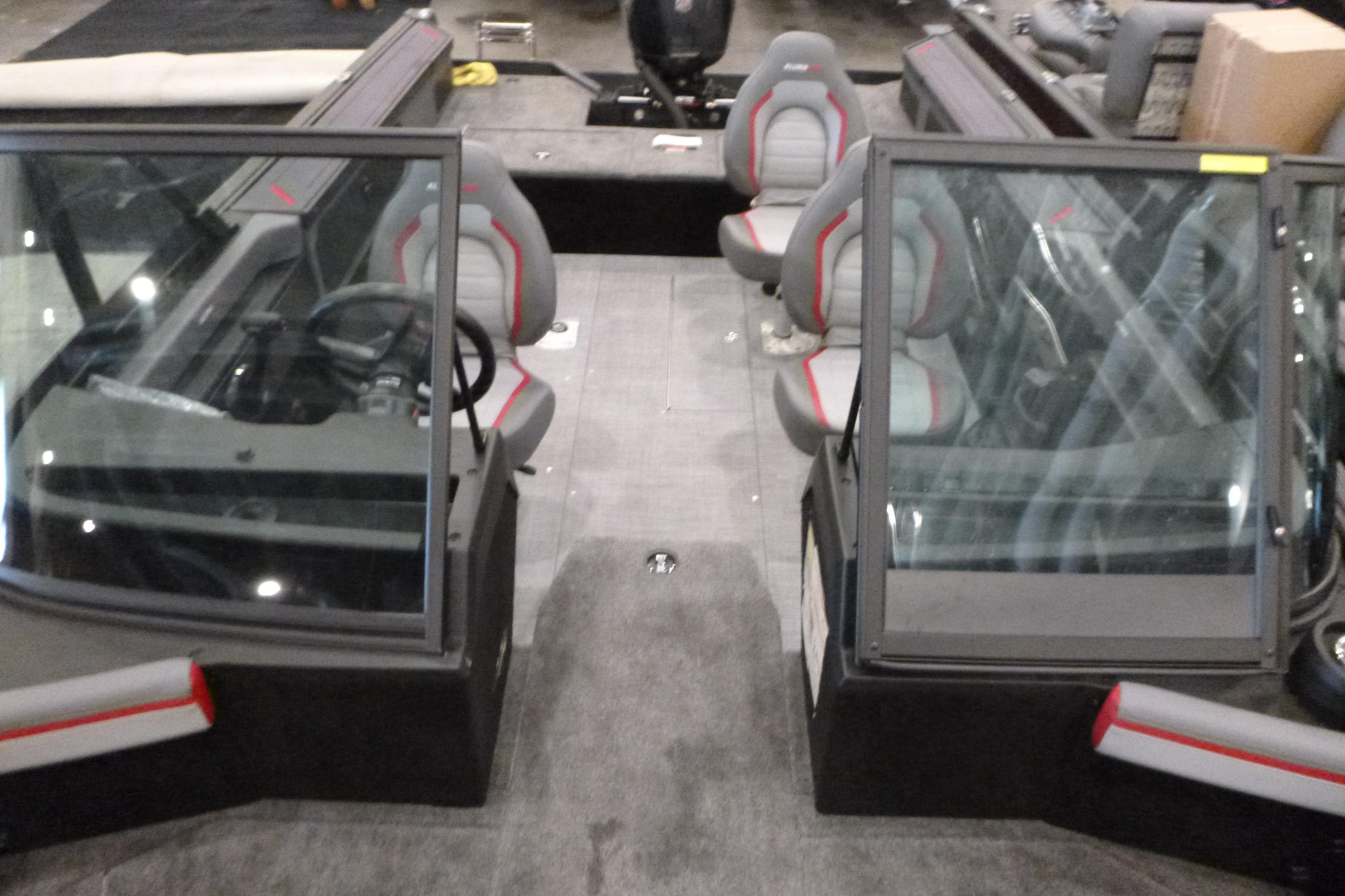 2025 Alumacraft Trophy 185X Sport interior with dual consoles and seating.