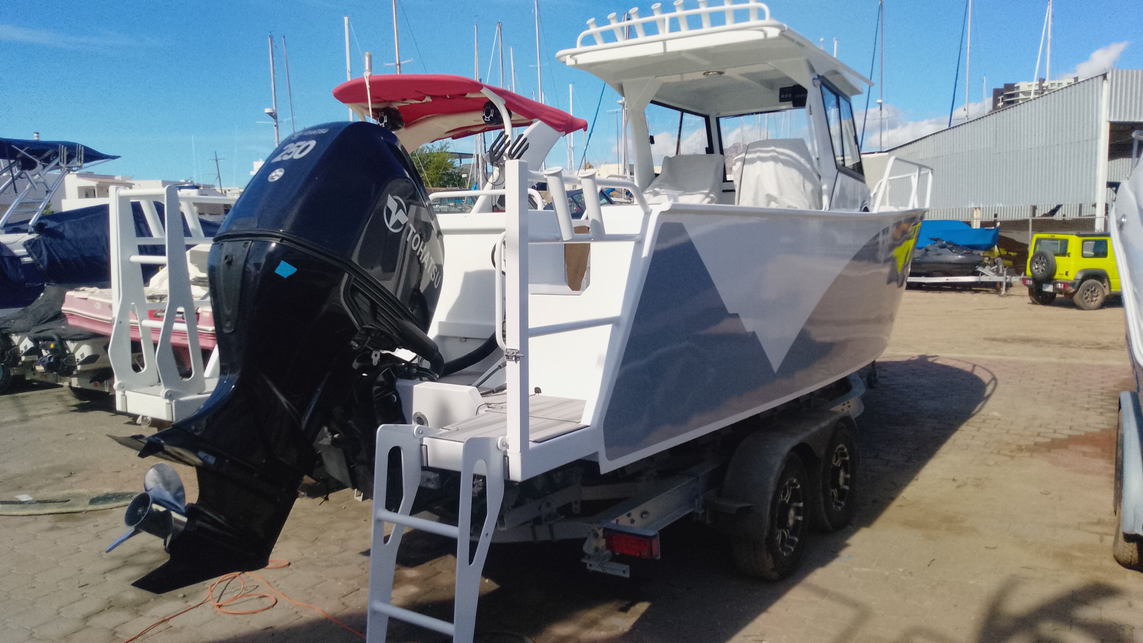 Gospel Boat 7.5M 2024 with outboard motor on trailer.