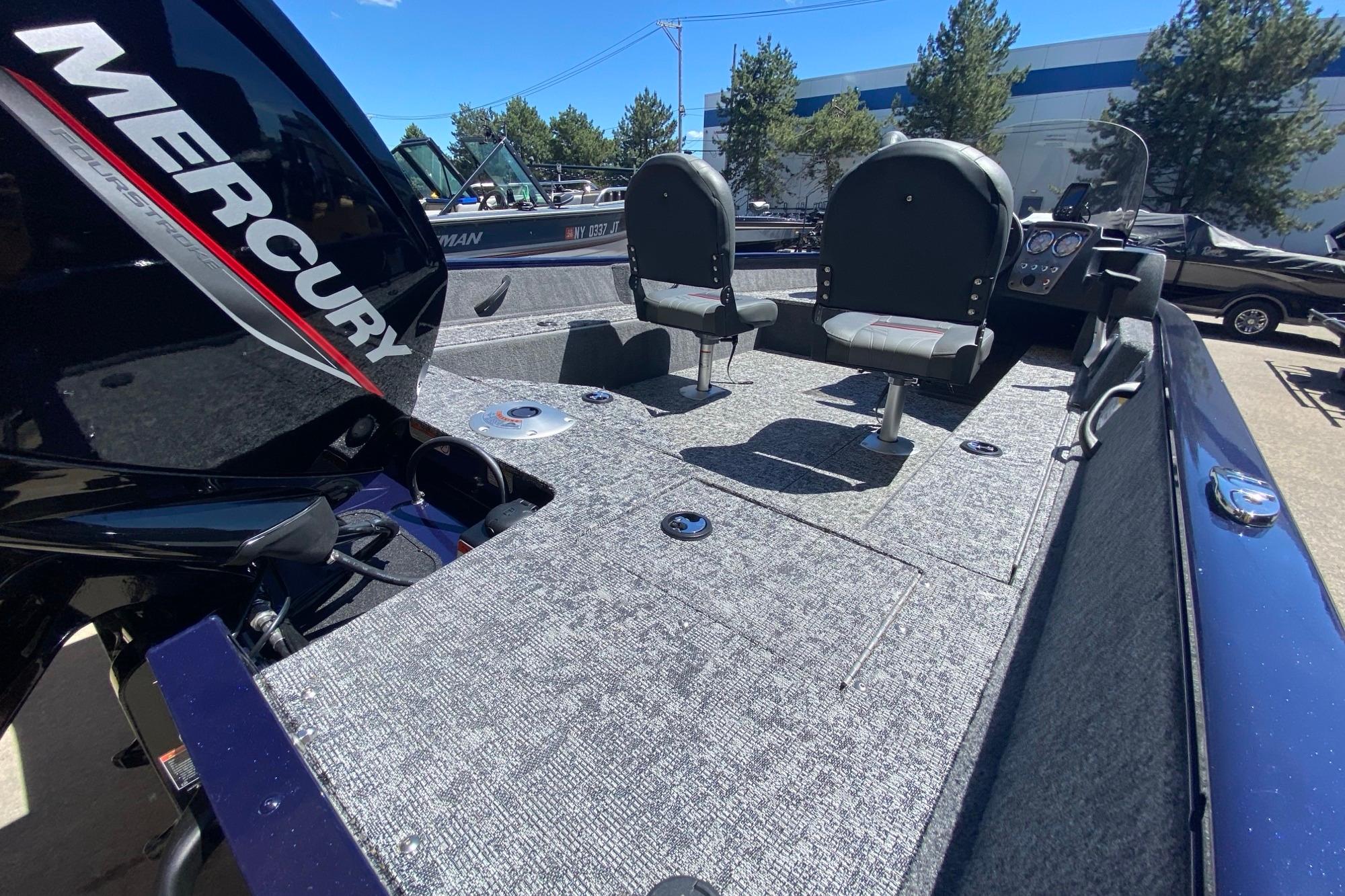 2026 Tracker Pro Guide V-16 SC boat interior with Mercury engine, featuring two seats and control panel.