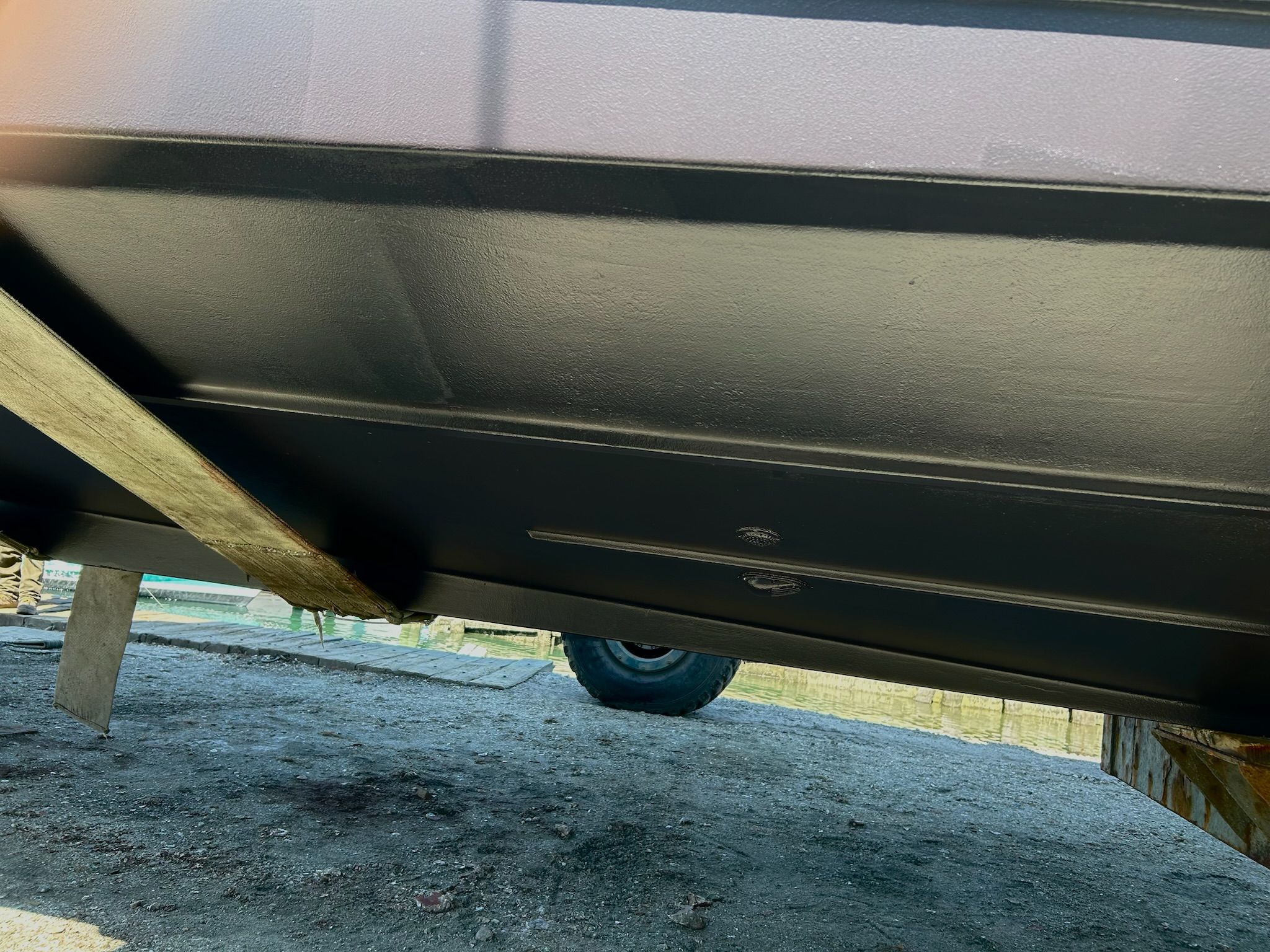 Underside of a 2000 Carver 356 Aft Cabin Yacht on a trailer.