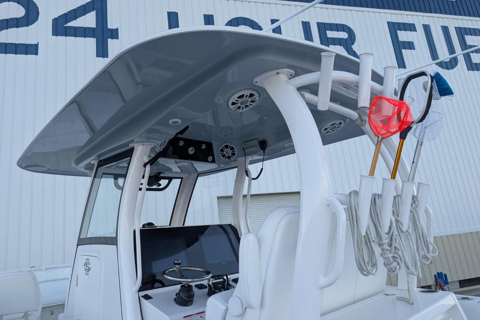 2024 Sportsman Open 302 Center Console boat with fishing gear and modern helm.