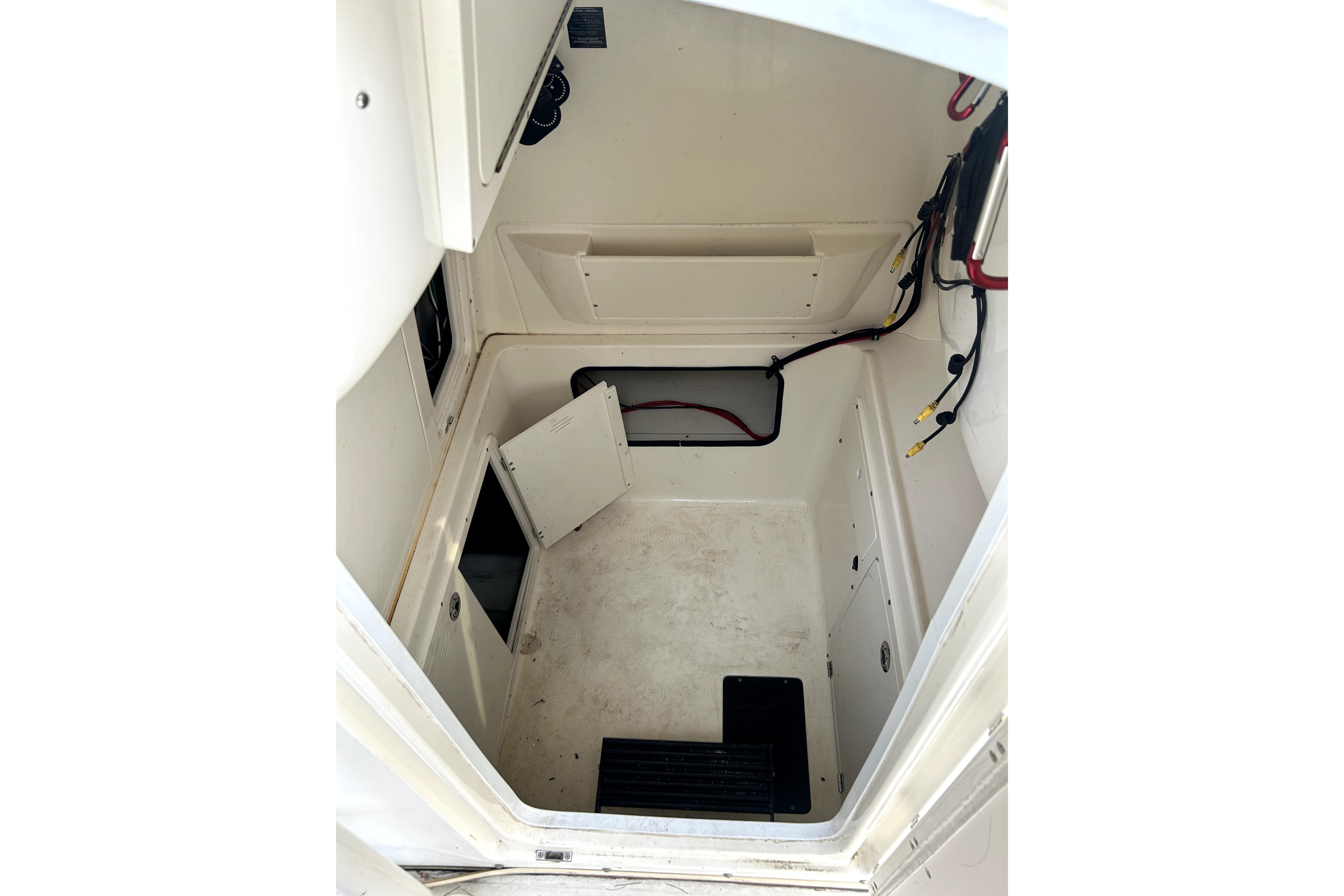 Interior view of a 2012 Boston Whaler 320 Outrage boat compartment.
