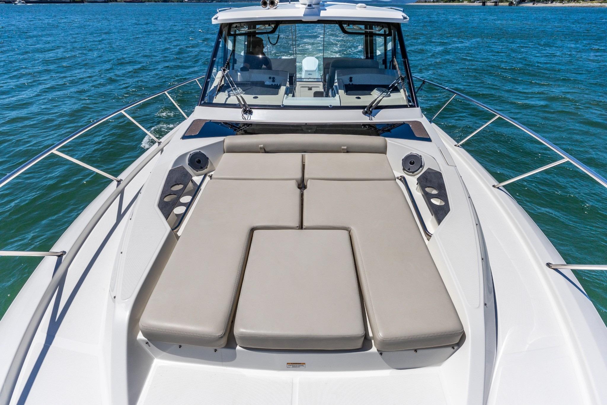 2023 Boston Whaler 405 Conquest boat with spacious deck and luxurious seating on the water.