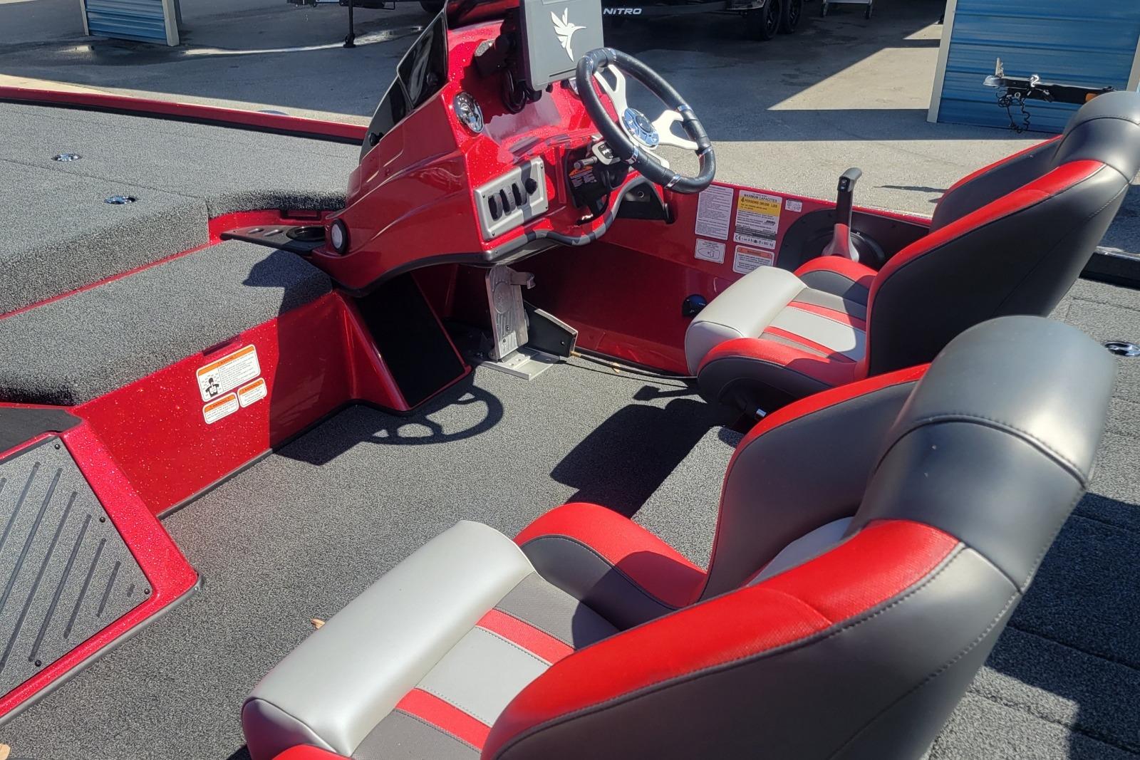 Red and gray interior of 2026 Nitro Z18 boat with dual seats and steering console.
