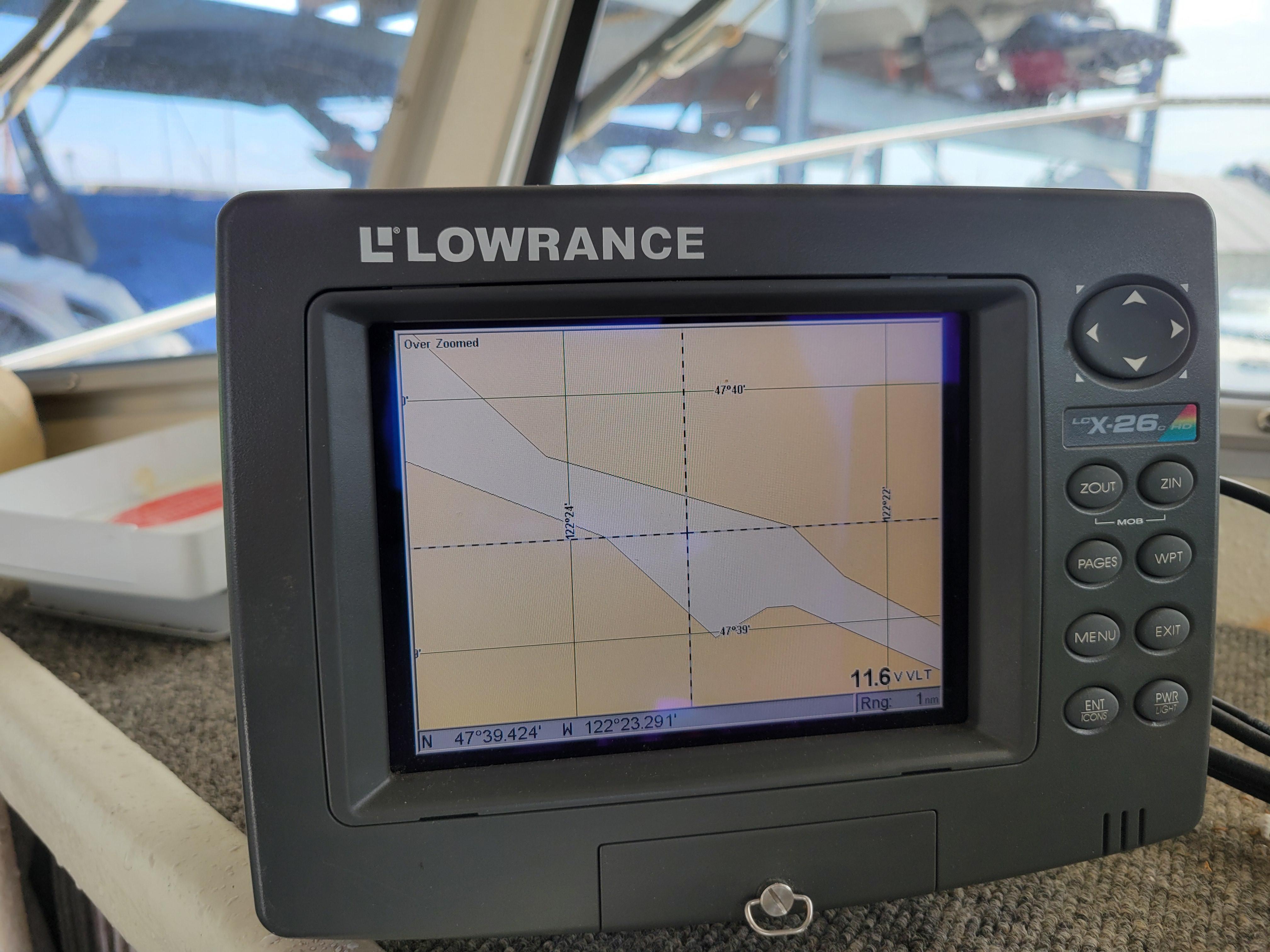 Lowrance GPS device on 1999 SeaSport 2400 XL Limited boat, displaying navigational map.