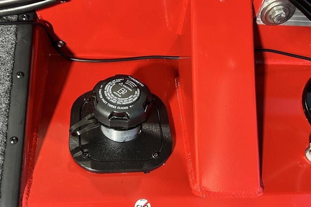Fuel cap on red Tracker Pro Team 175 Crappie Edition boat, 2026 model.