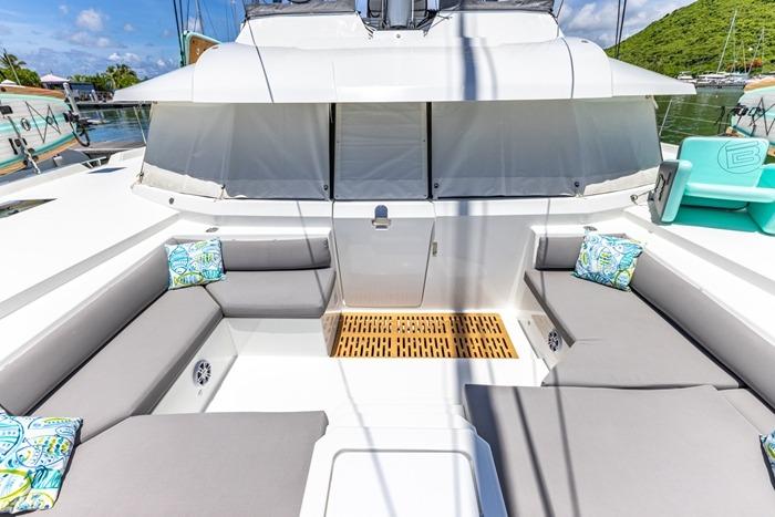 2023 Fountaine Pajot Samana 59 yacht with spacious outdoor seating and decorative cushions.