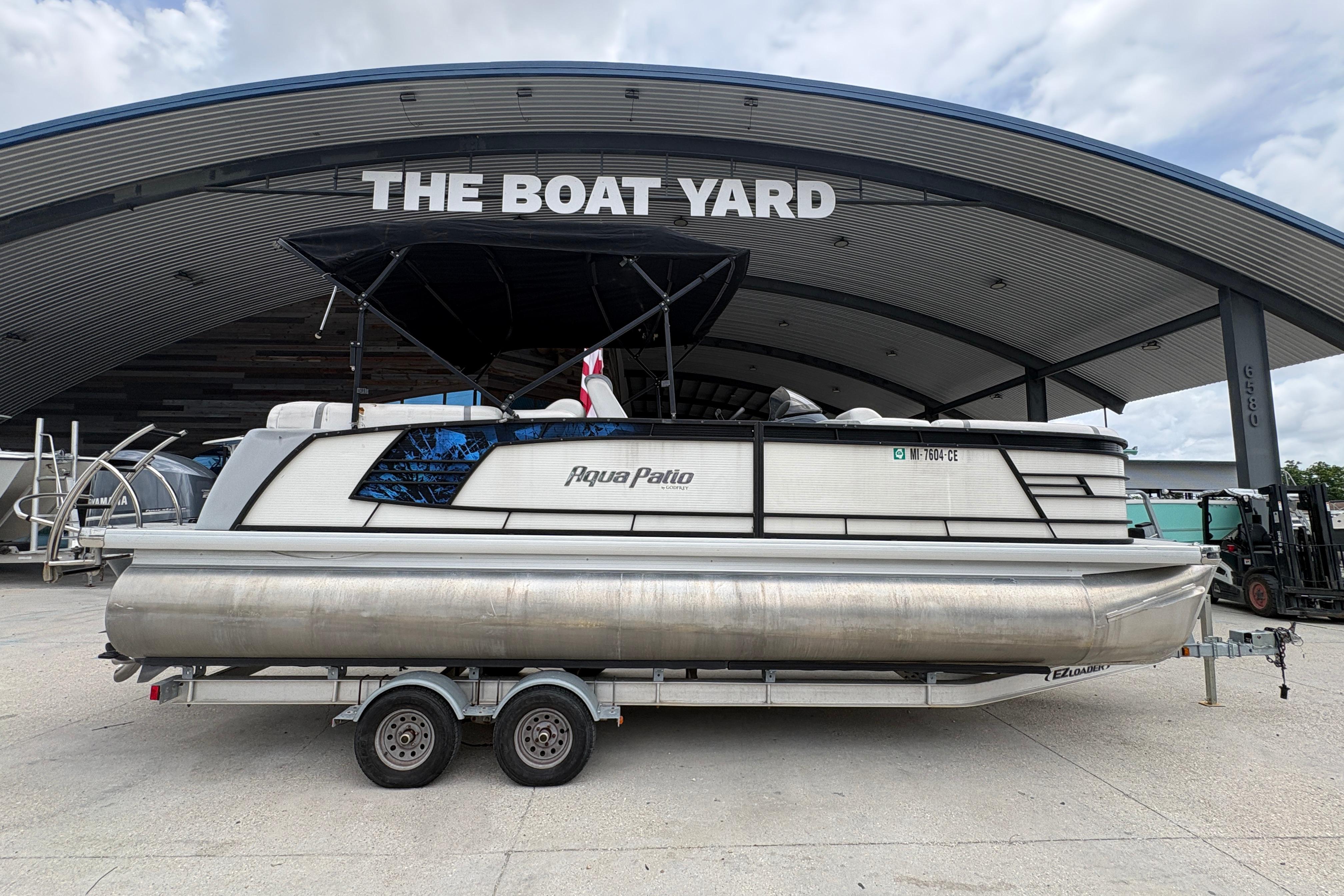 2019 Godfrey Aqua Patio pontoon boat on trailer at The Boat Yard.