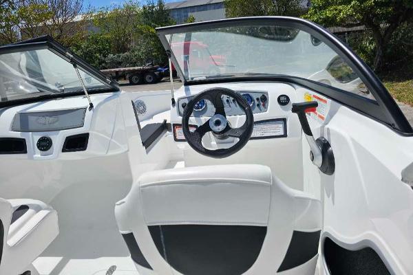2025 Tahoe 185 S boat interior with steering wheel and dashboard controls.