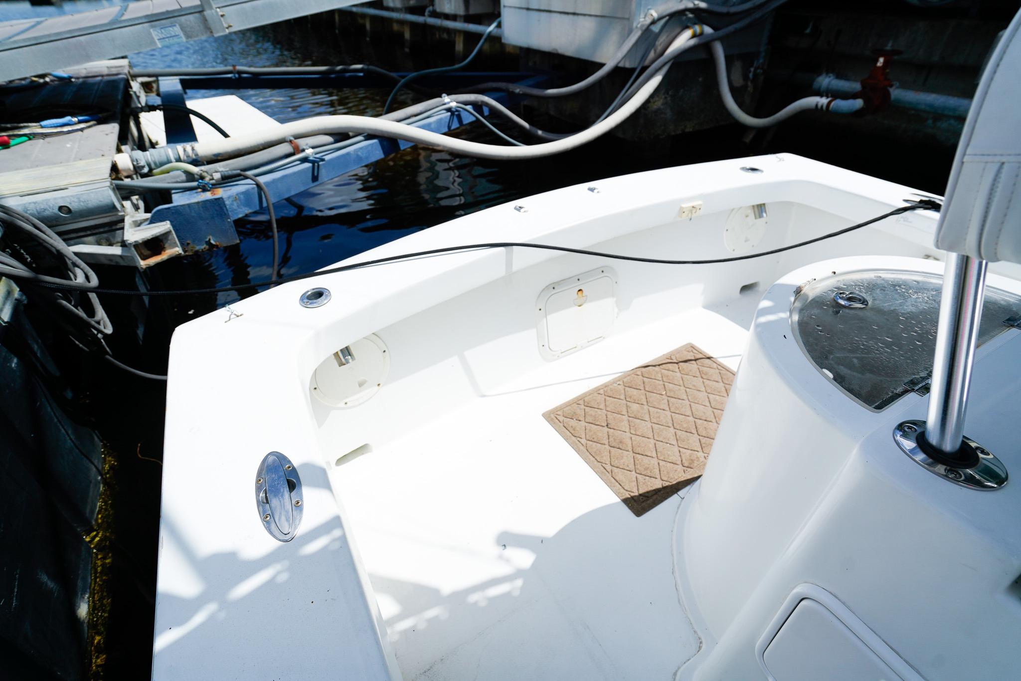 1977 Scarborough 27 CC boat interior at dock, featuring clean white deck.