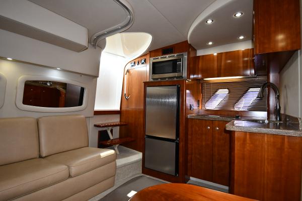 Interior of 2010 Cruisers Yachts 390 Sports Coupe with modern kitchen and seating area.