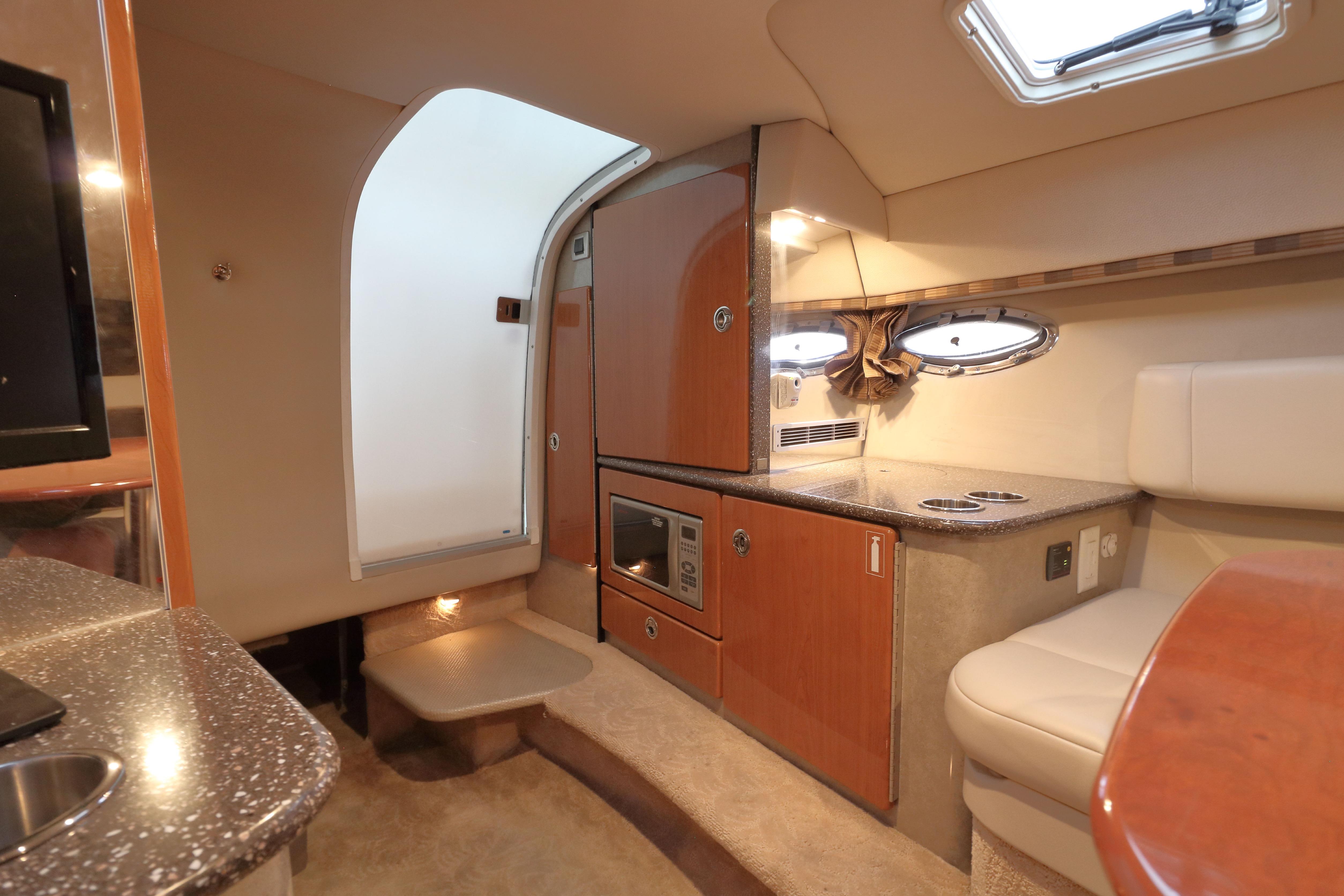 Interior of 2006 Formula 330 Sun Sport boat with kitchenette and seating area.