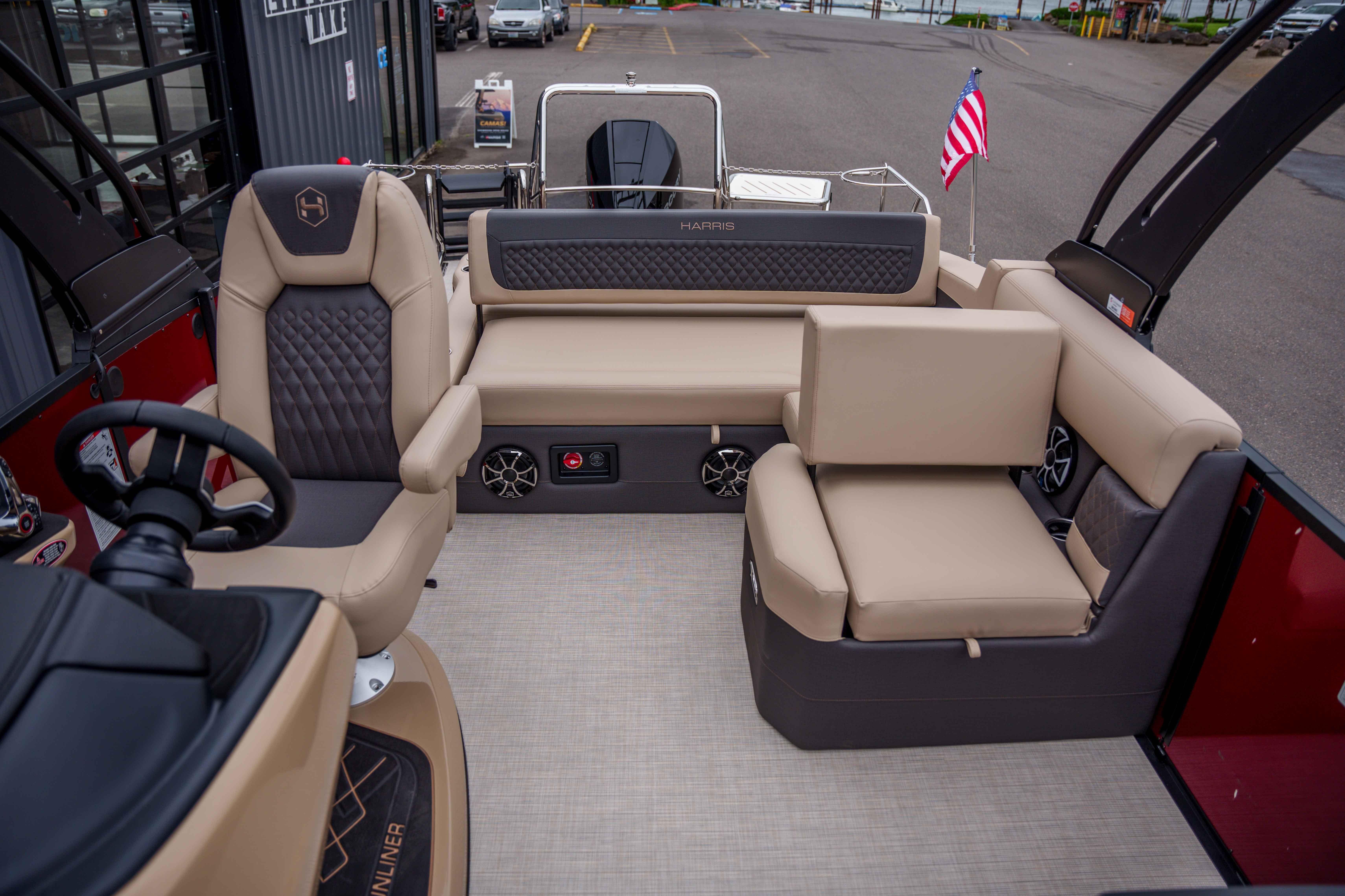 Luxurious interior of 2026 Harris Sunliner 230 pontoon boat with plush seating and modern design.