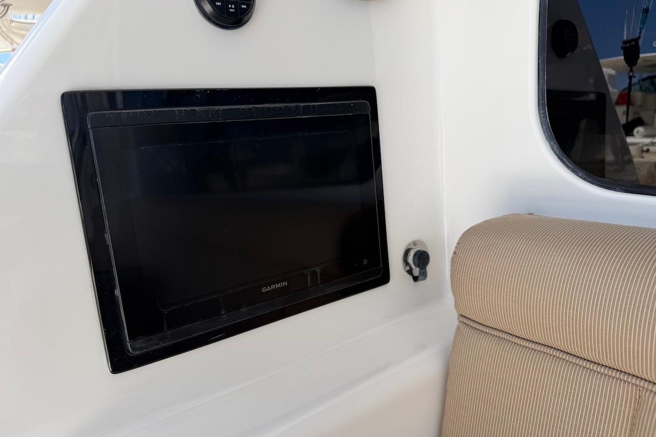 Garmin display on 2012 Viking 50 Convertible yacht, featuring beige seating.