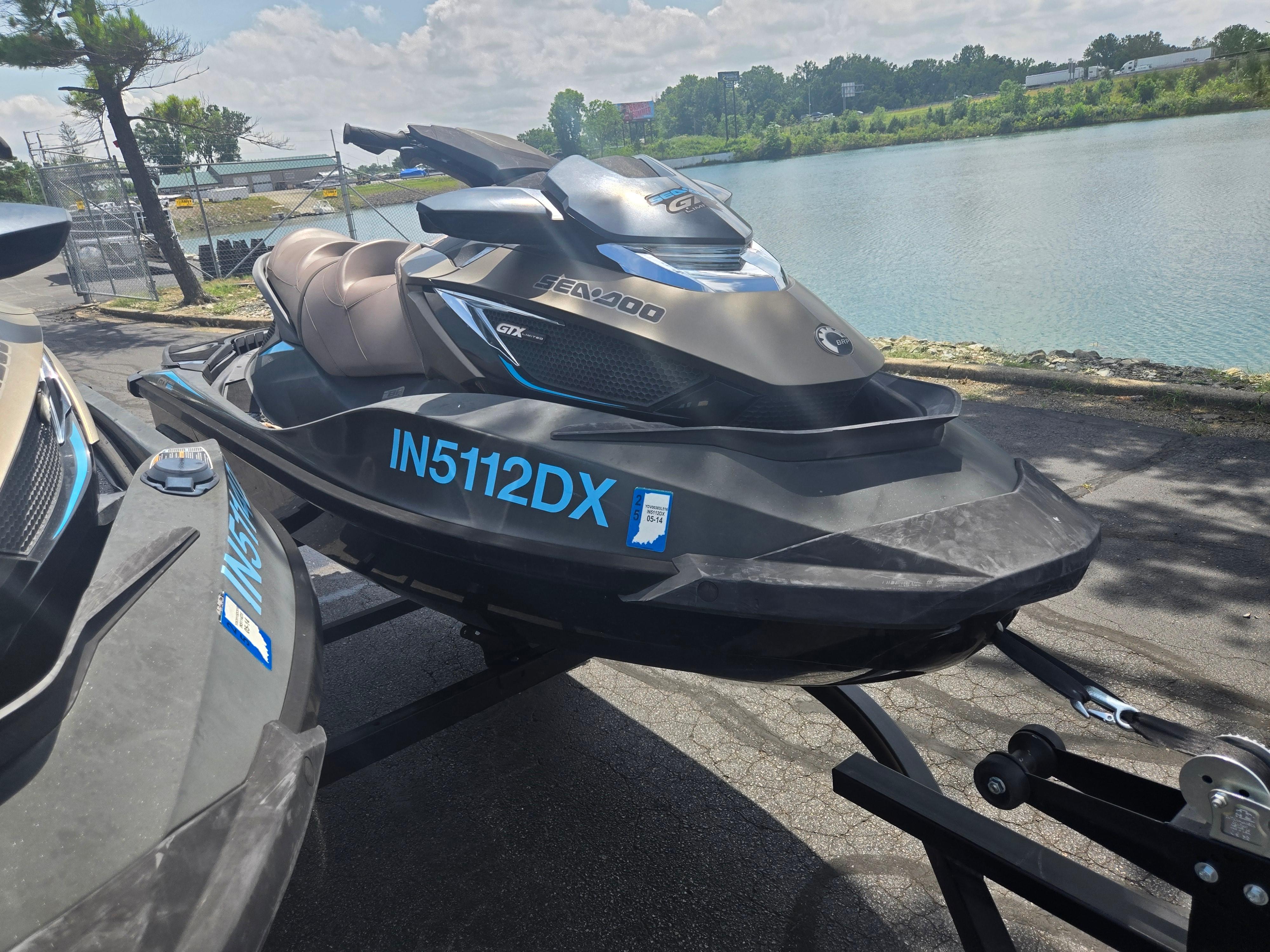 2016 Sea-Doo GTX Limited iS 260 jet ski on trailer by a lake.