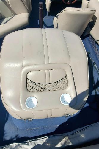 2000 Calabria Sport Comp XTS boat interior with beige seating and cup holders.