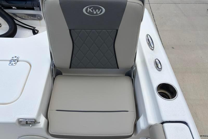 2025 Key West 210 Bay Reef boat seat with cup holders and storage compartment.