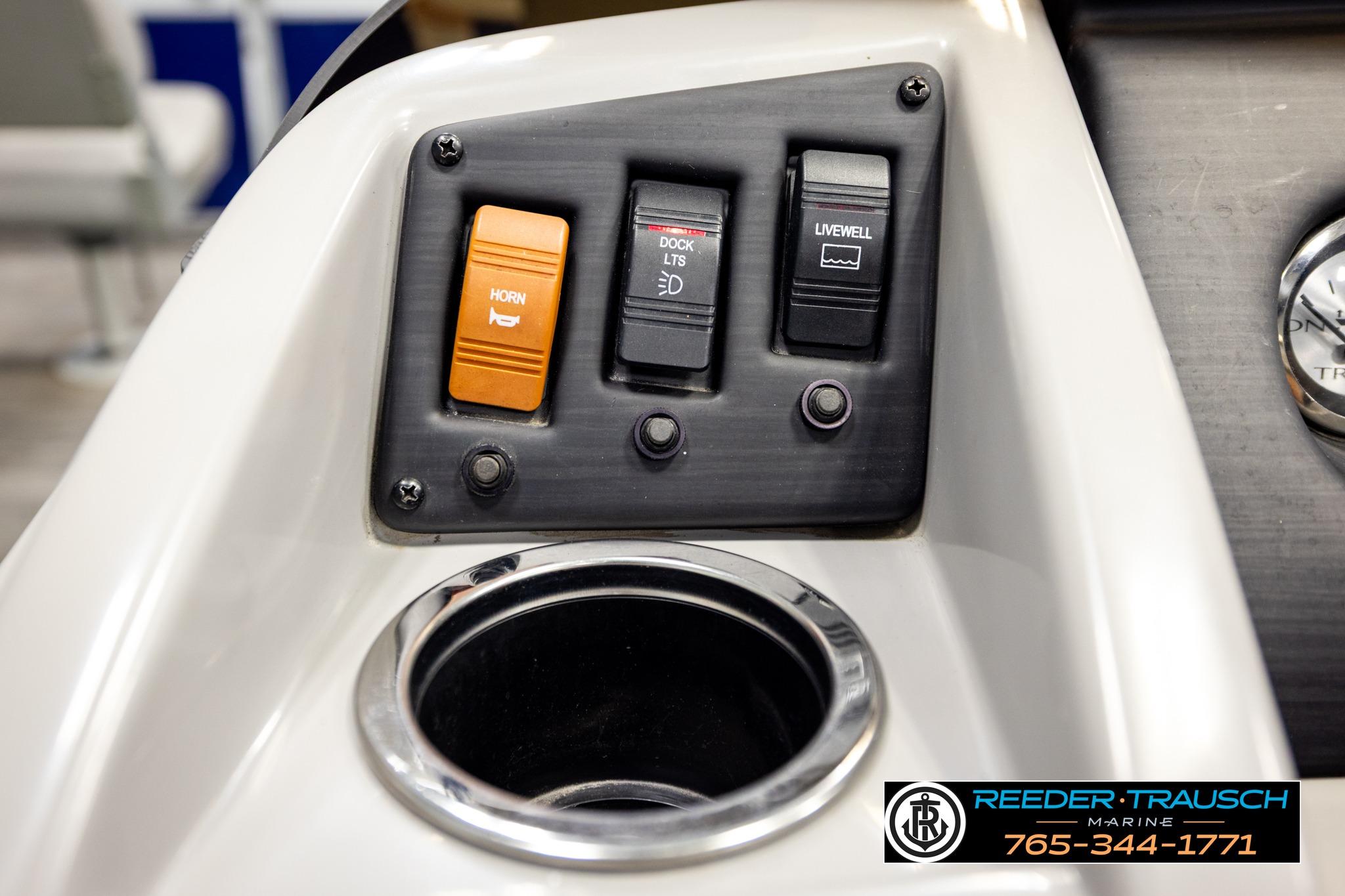 Control panel of a 2021 Bennington 20 SV boat with horn and livewell switches.