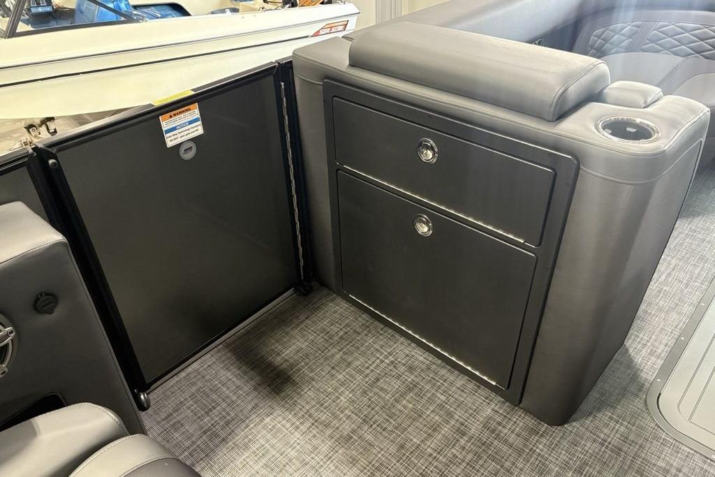 Interior of 2026 Godfrey Monaco 235 SFLC iMPACT 2.0, featuring sleek storage compartments.