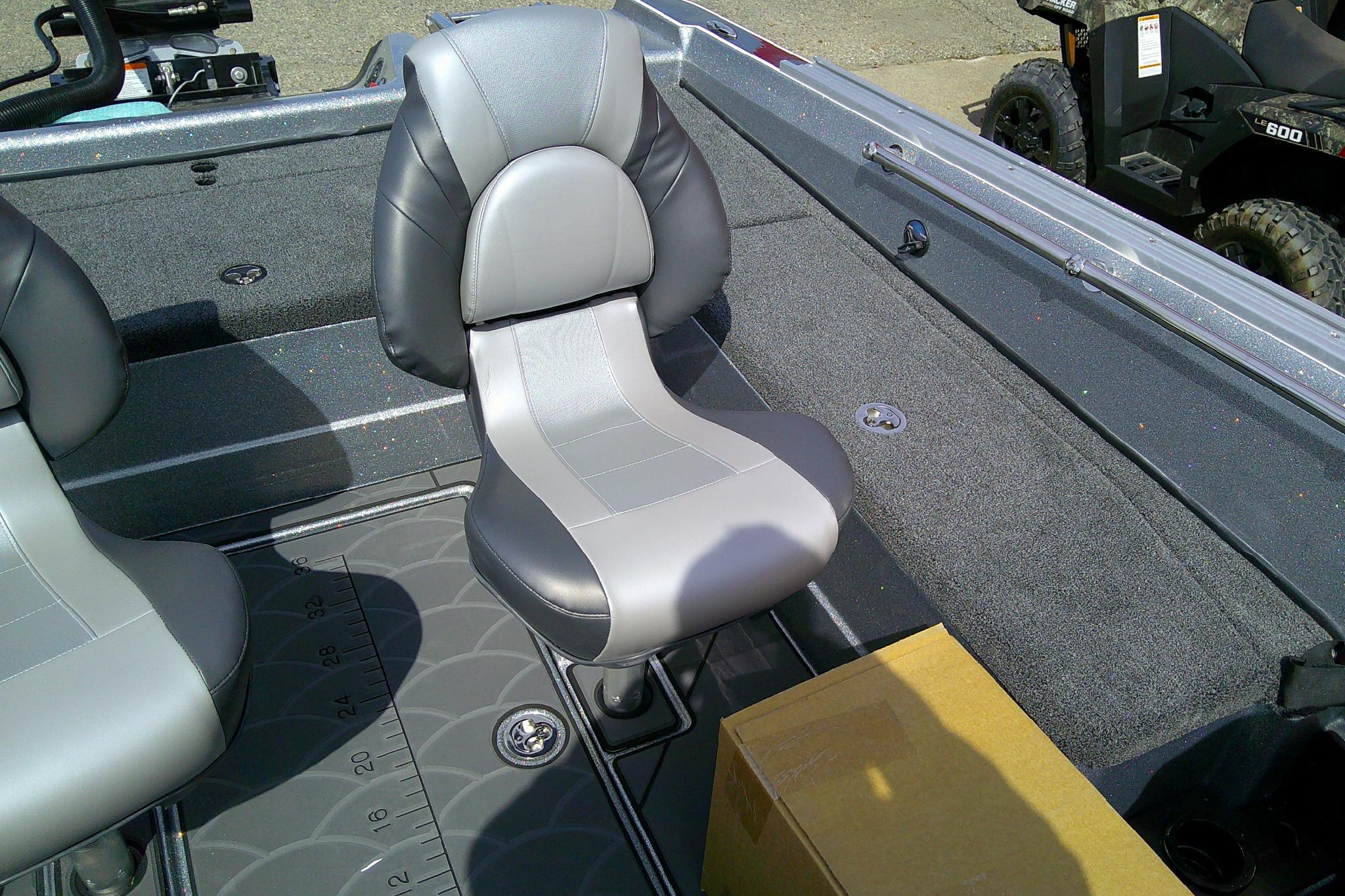 Interior of 2026 Nitro ZV21 Pro boat with gray seating and measuring mat.