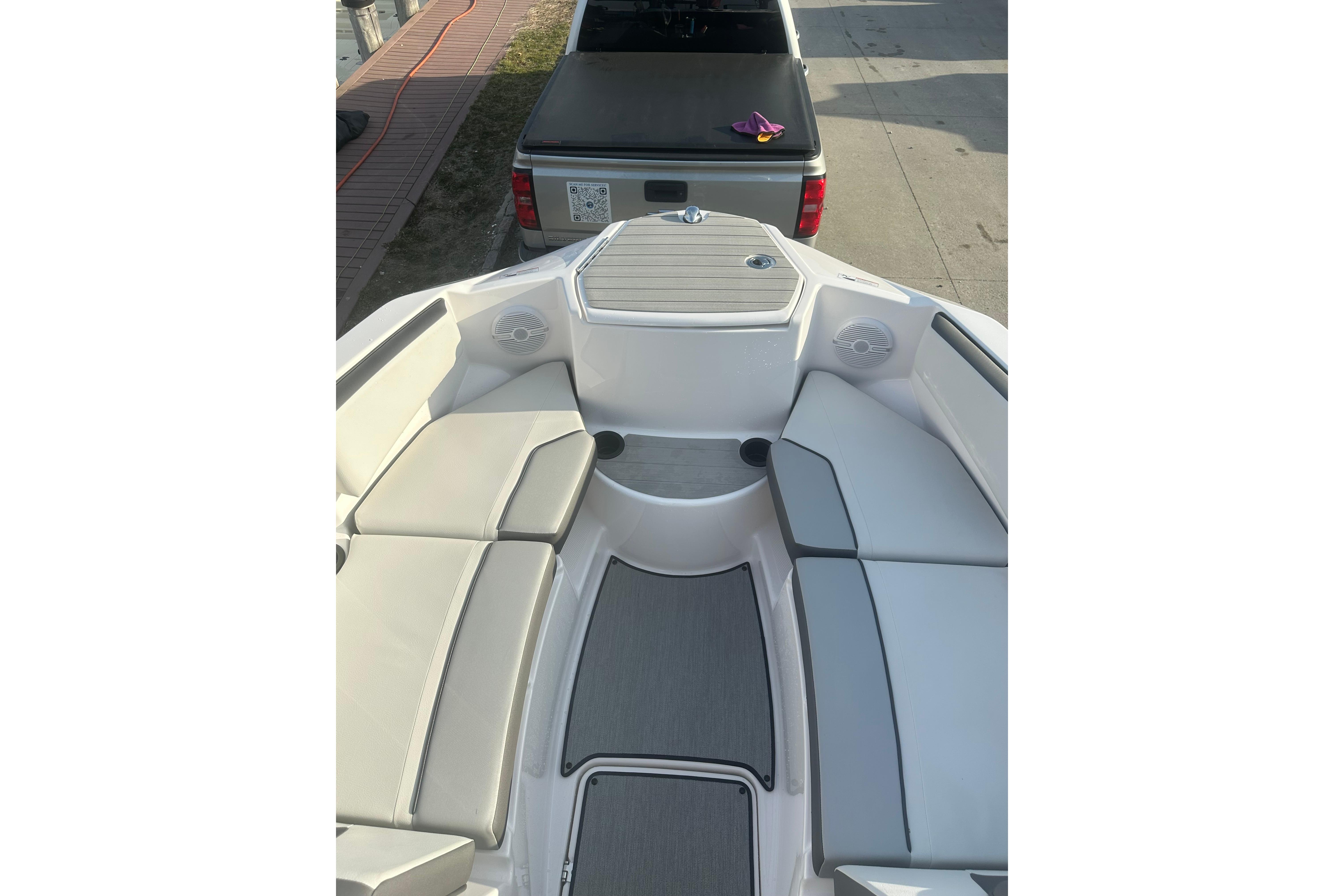 2025 Yamaha Boats AR220 interior with cushioned seating and modern design.