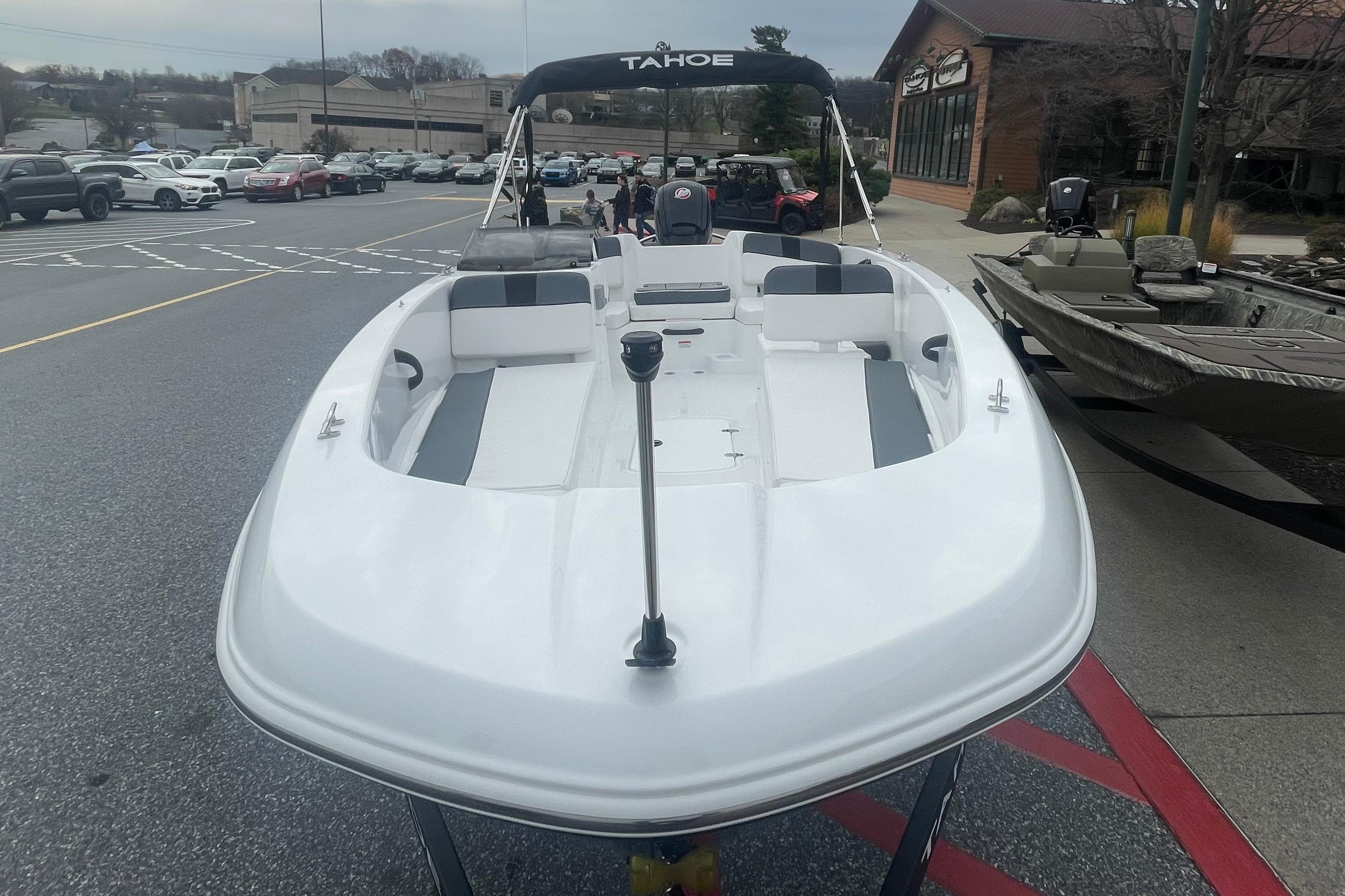 2026 Tahoe T18 boat displayed outdoors, showcasing sleek design and spacious seating.