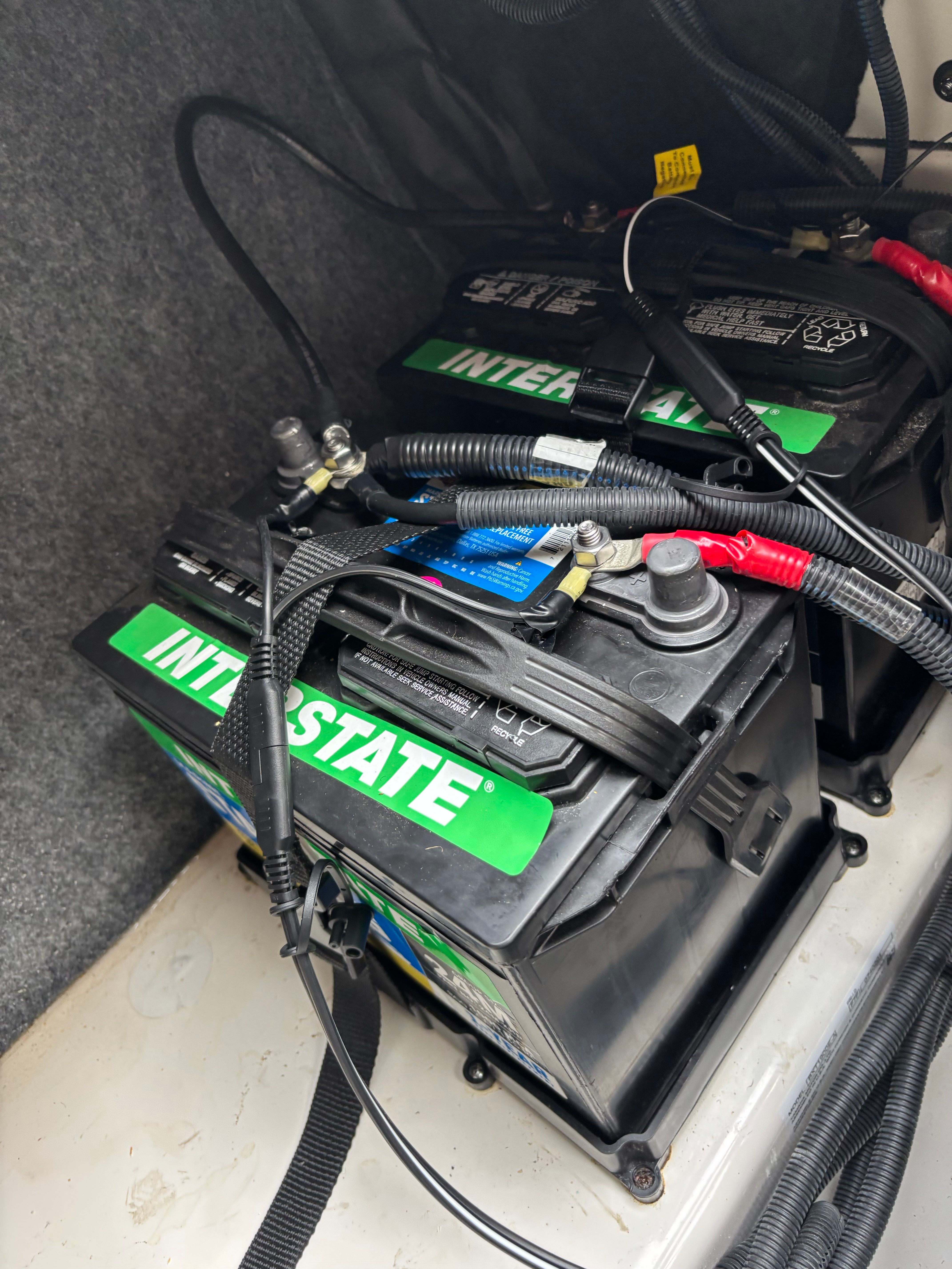 Boat batteries inside a 2024 Yamaha AR250.