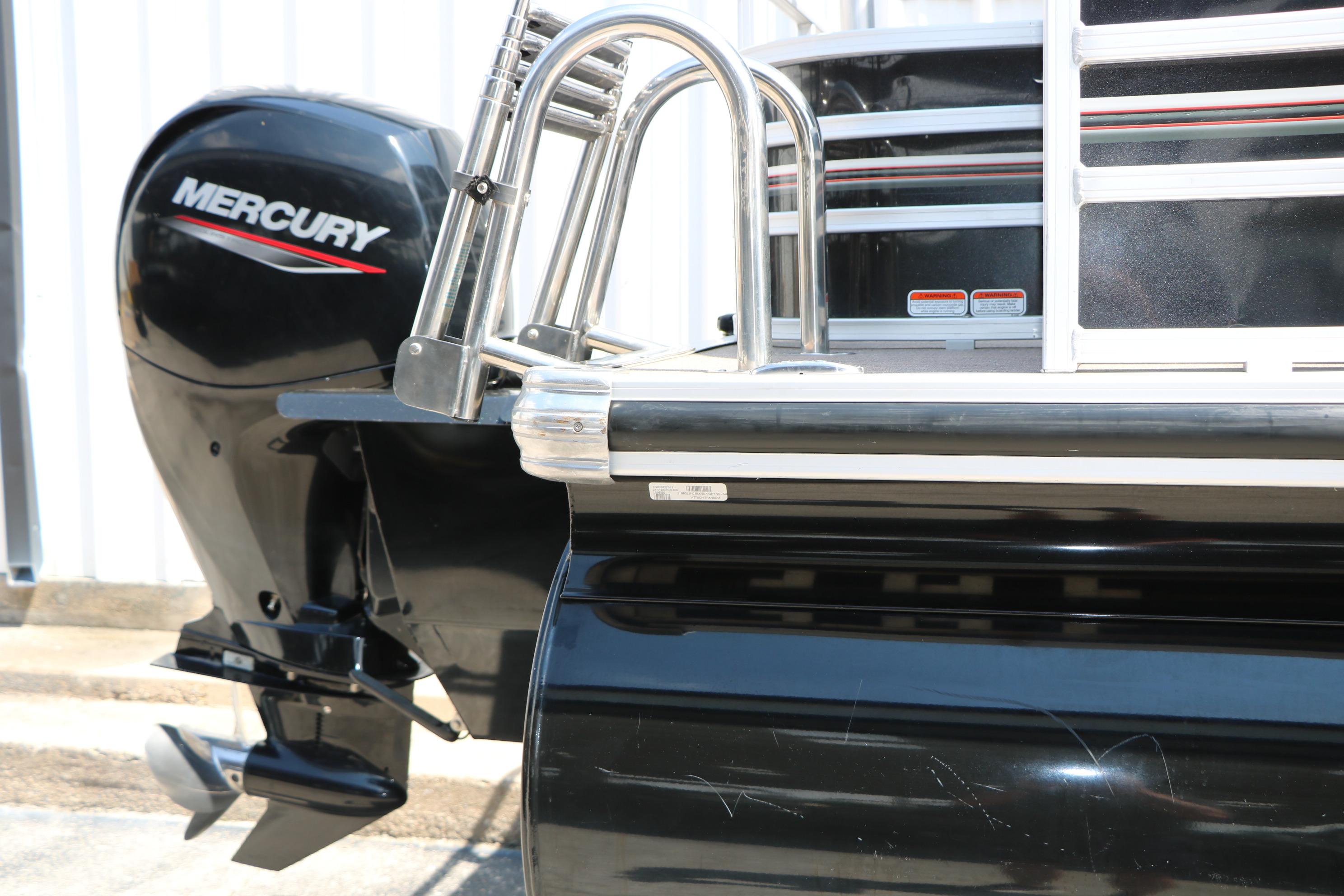 2021 Ranger 223FC boat with Mercury outboard motor, featuring sleek black design.