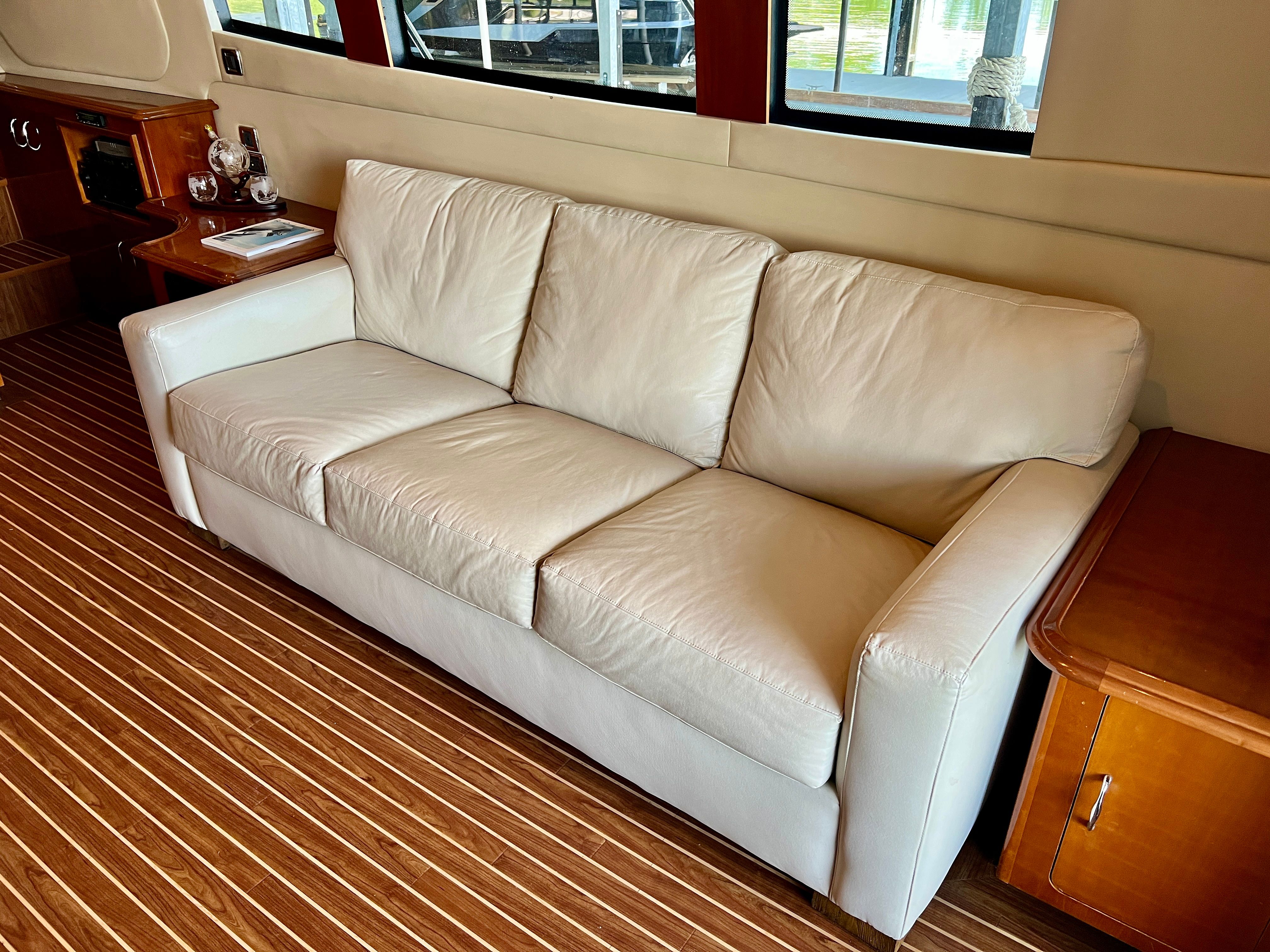 Interior of Carver 560 Voyager Sky yacht with leather sofa.
