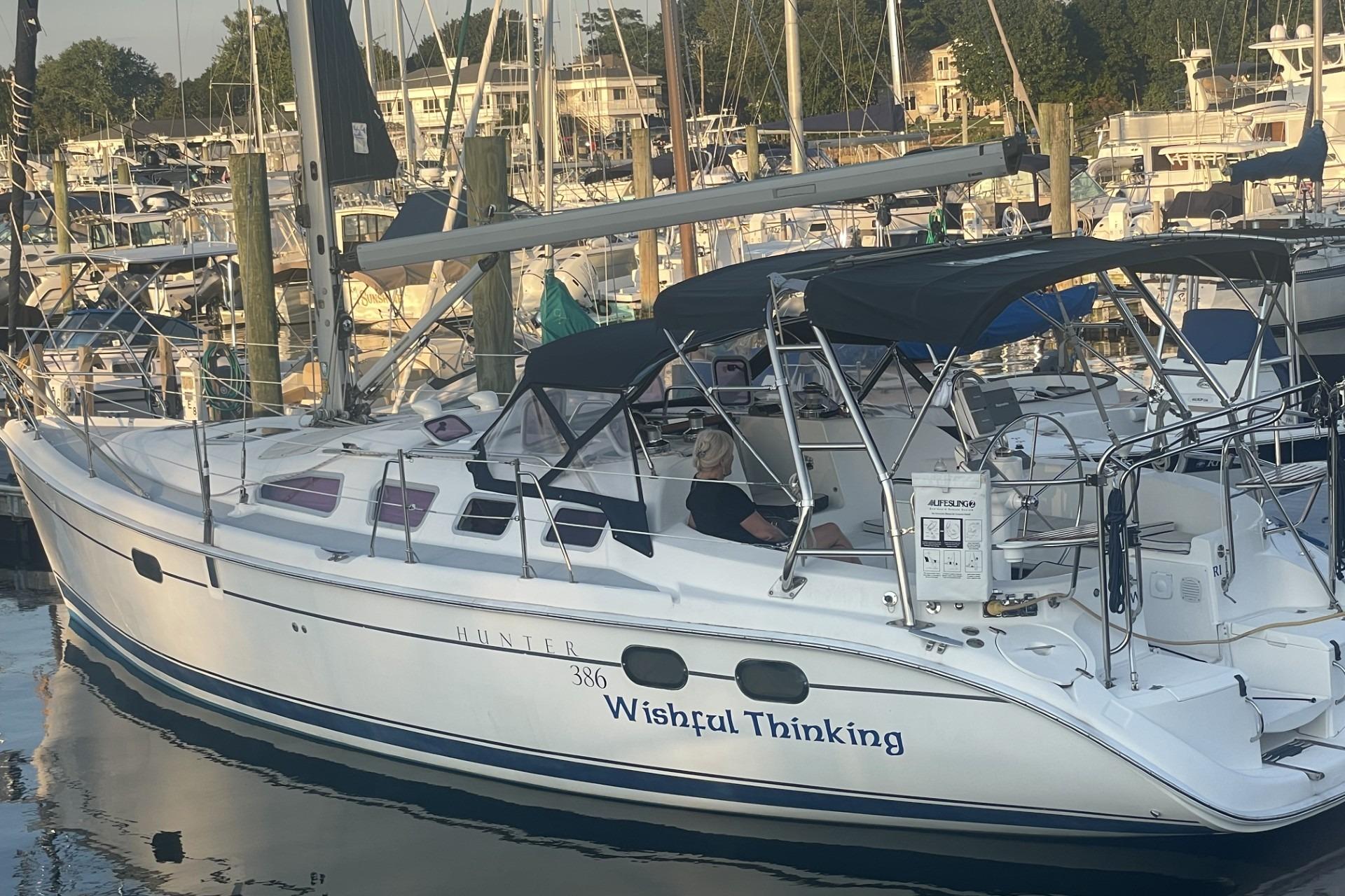 Hunter 386 sailboat named "Wishful Thinking" docked at marina, 2004 model.