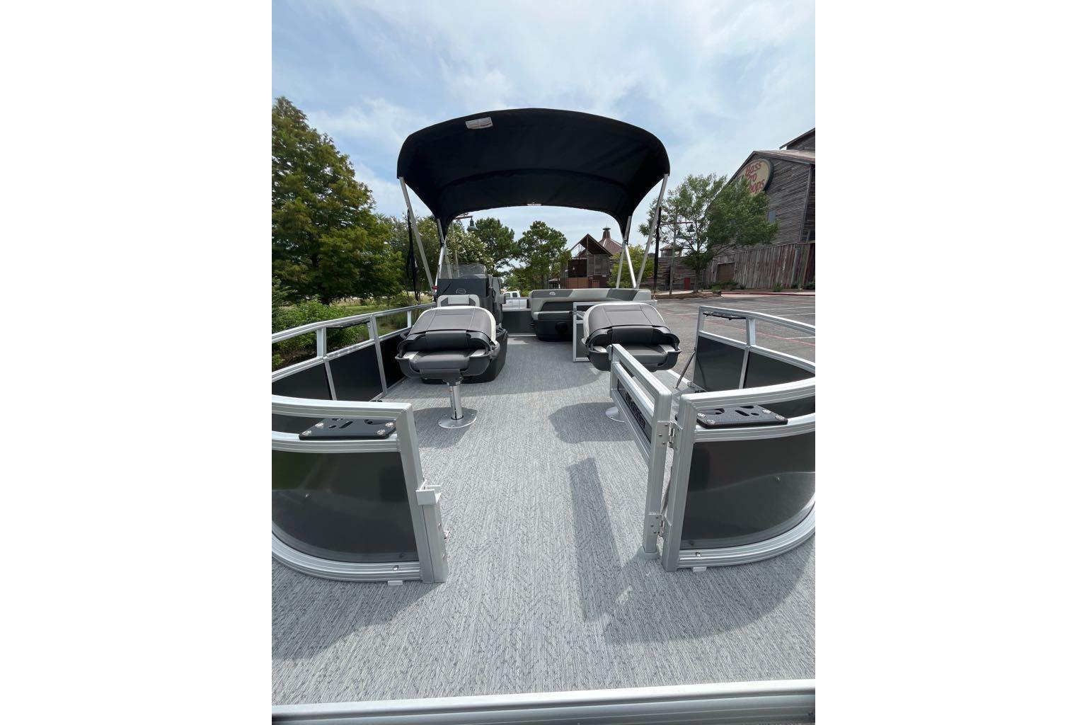 2026 Sun Tracker Bass Buggy 16 XL Select pontoon boat with canopy and seating.