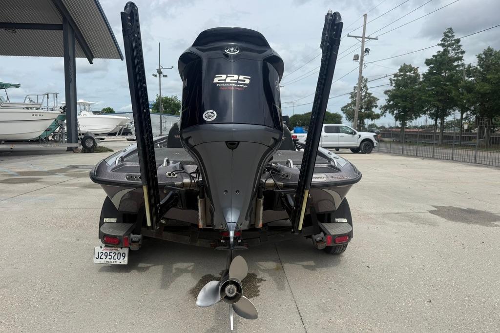 2018 Phoenix 919 ProXP boat with 225 horsepower engine, parked outdoors.