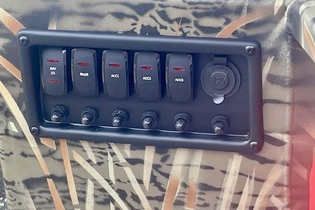 Control panel of 2026 Tracker Grizzly 1650 T Prairie Wings Edition with camo design.