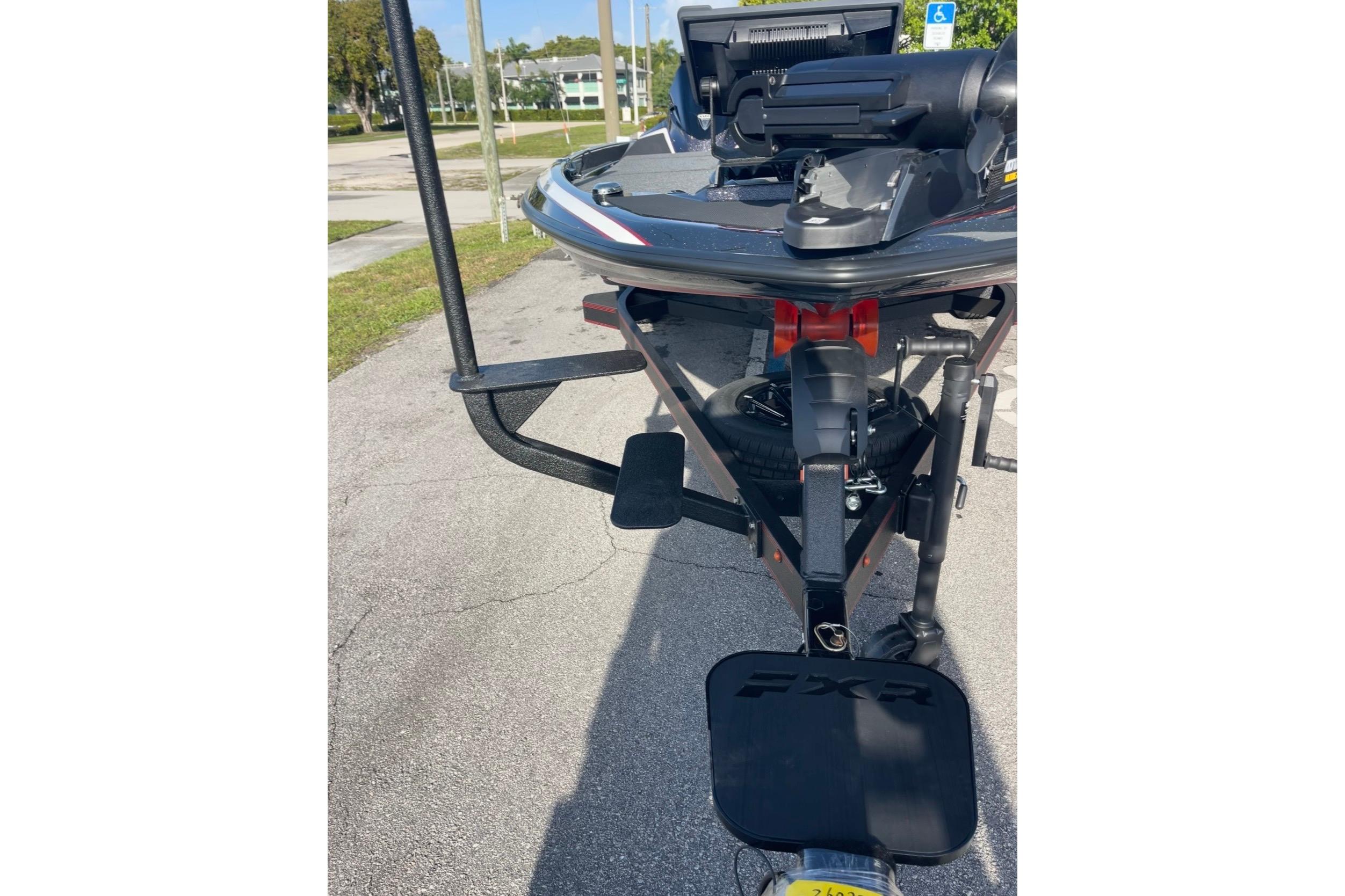 2026 Skeeter FXR20 FLEX boat trailer hitch and bow view in parking lot.