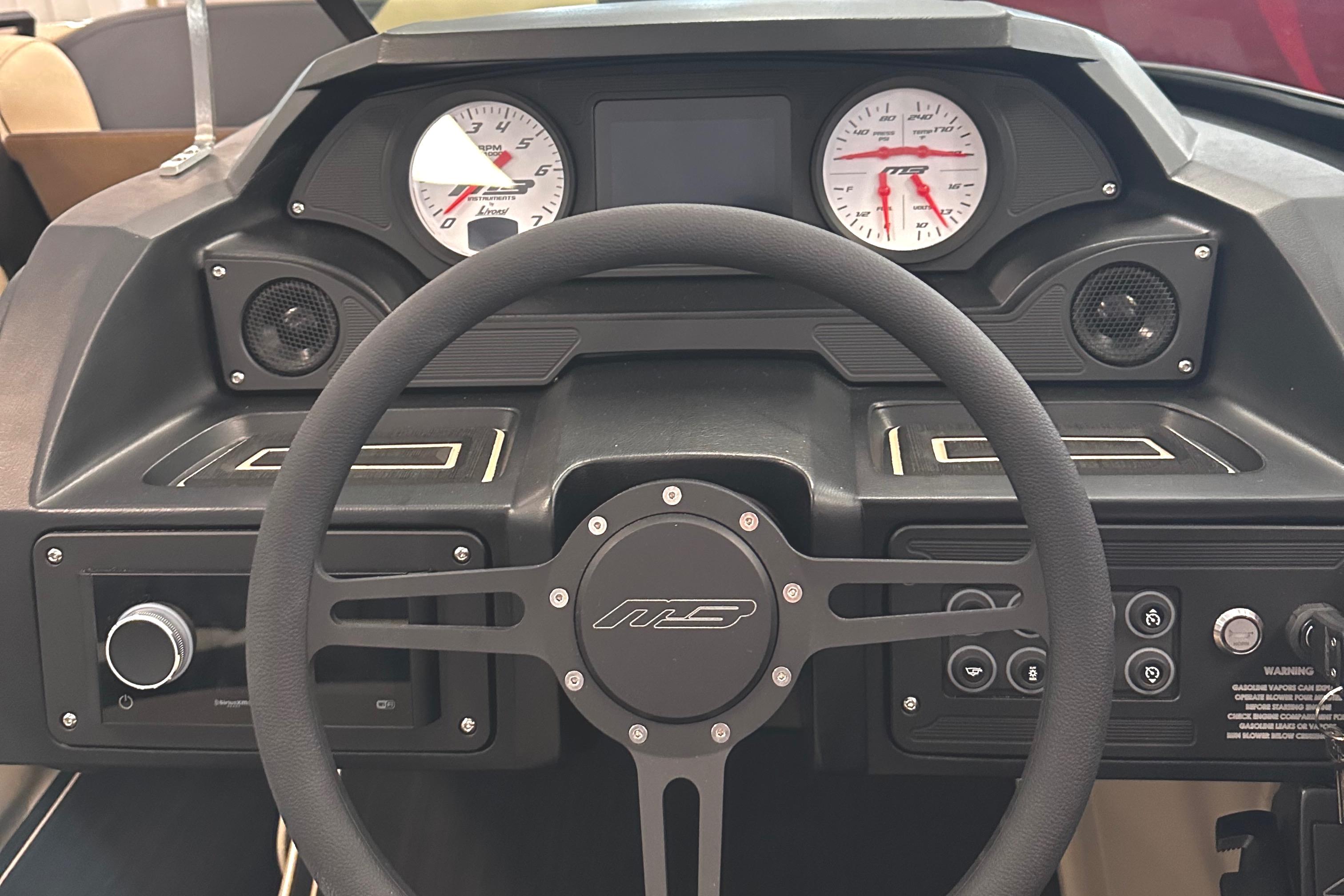 2024 MB F22 Tomcat dashboard with steering wheel and instrument panel.