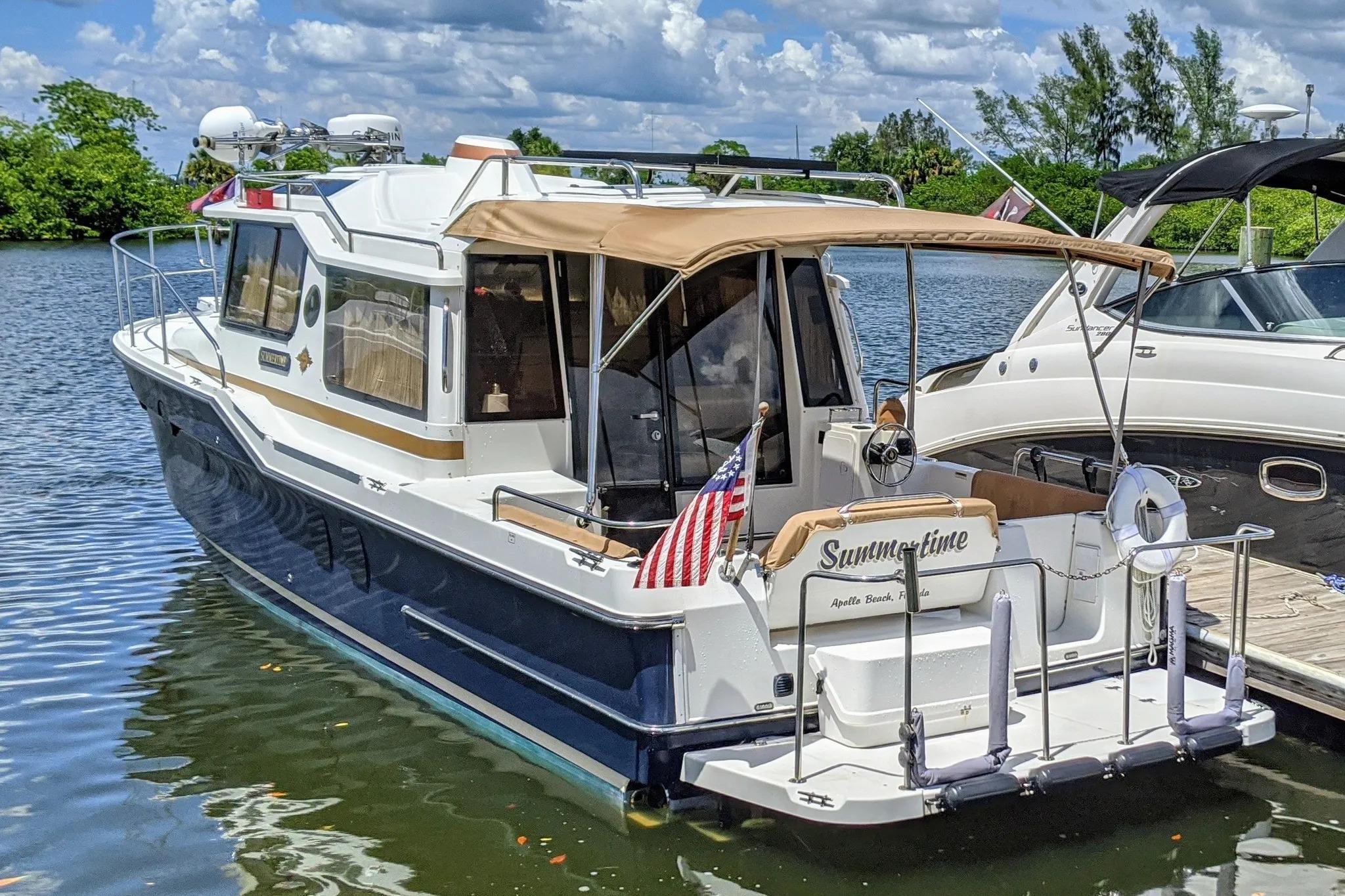 2015 Ranger Tugs R-29 S boat docked on a sunny day, featuring "Summertime" nameplate.