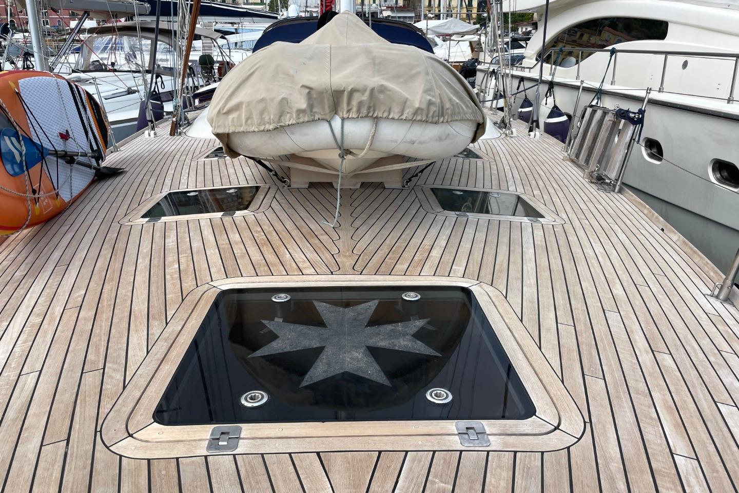 Deck of 2007 Franchini 63 S yacht with wooden finish and covered equipment.