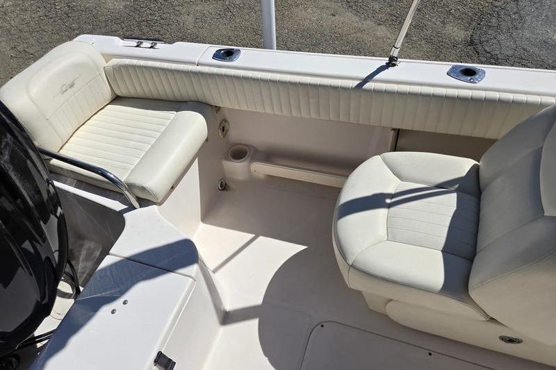 2007 Grady-White Tournament 205 boat interior with white seating and cup holder.