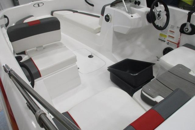 2024 Tahoe T16 boat interior with white and red seating, steering wheel, and storage compartments.